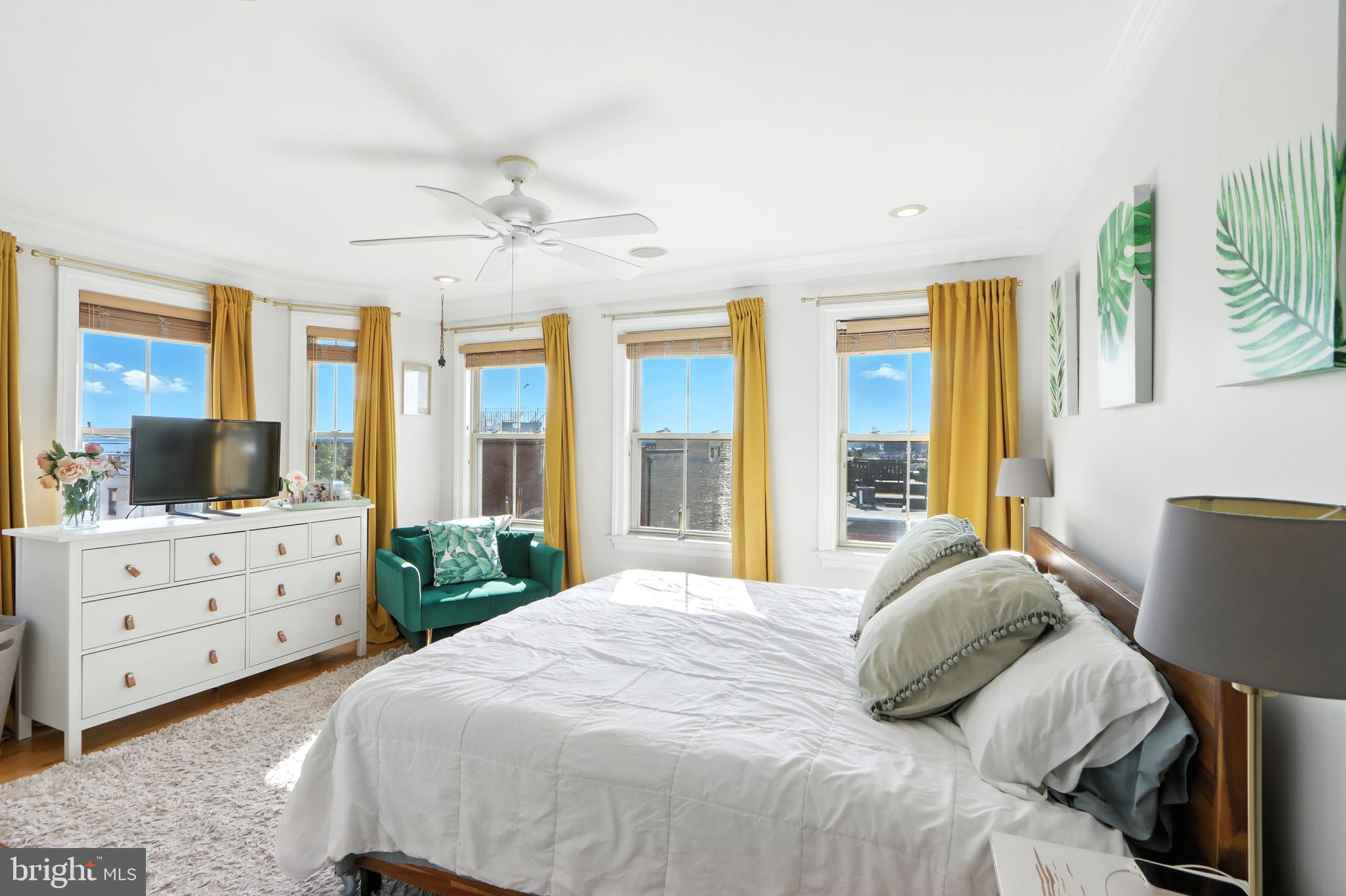 Discover nearly 2,900 square feet of beautifully finished living space across four thoughtfully designed levels, blending historic character with modern luxury. This distinctive home offers an ideal layout for those seeking both comfort and sophistication in the heart of Brewers Hill and Canton.
Entertain with ease on two private rooftop decks, the perfect setting for summer gatherings, breathtaking Harbor views, and an unforgettable vantage point for the Fourth of July fireworks. Inside, gleaming hardwood floors, soaring ceilings with recessed lighting, and two working fireplaces create a warm and inviting atmosphere.
The gourmet kitchen is a chef’s dream, featuring custom dual-glazed soft-close cabinetry, granite countertops, stainless steel GE appliances, an oversized island, and an adjoining dining area. Two additional wet bars provide seamless convenience for entertaining or enjoying quiet evenings at home.
The lower level offers flexible space for a game room, home office, or fitness studio. Upstairs, the third floor features two spacious bedrooms and a spa-inspired bath with a jetted soaking tub, frameless glass shower, and European tile. A full laundry and mudroom with custom storage systems add everyday practicality.
The fourth level is dedicated to the luxurious primary suite, complete with a custom walk-in closet and a spa-style bath. A private den and additional office or fourth bedroom offer flexible living options. From here, ascend to your private rooftop oasis via interior stairs—a rare and highly desirable feature.
Additional highlights include dual-zone natural gas heating, updated central air, ceiling fans throughout, and dedicated off-street parking with additional guest parking nearby.
This home offers the perfect balance of city living and family comfort, just blocks from Baltimore’s most celebrated restaurants, shops, and parks. Walk to your sports events or meet your dog friends at Patterson Park. Walk to a restaurant on every corner and all the big stores you need. Holiday Lovers: there is a wired spot in each window for your candles! Sellers are ready for a quick and seamless transition, contingent on their pending purchase of a new home. CFHOC.
