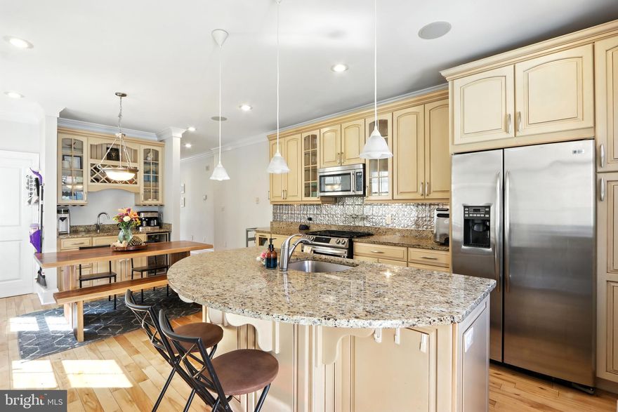 SMART BUYER ALERT! Just reduced, this gem will make you smile as you discover nearly 2,900 square feet of beautifully finished living space across four thoughtfully designed levels, blending historic character with modern luxury. This distinctive home offers an ideal layout for those seeking both comfort and sophistication in the heart of Brewers Hill and Canton. Back yard patio fits your car or small BBQ spot.  Empty lot is not for sale and owned privately for residential use. Common to see dogs play there.
Entertain with ease on two private rooftop decks, the perfect setting for summer gatherings, breathtaking Harbor views, and an unforgettable vantage point for the Fourth of July fireworks. Inside, gleaming hardwood floors, soaring ceilings with recessed lighting, and two working fireplaces create a warm and inviting atmosphere.
The gourmet kitchen is a chef’s dream, featuring custom dual-glazed soft-close cabinetry, granite countertops, stainless steel GE appliances, an oversized island, and an adjoining dining area. Two additional wet bars provide seamless convenience for entertaining or enjoying quiet evenings at home.
The lower level offers flexible space for a game room, home office, or fitness studio. Upstairs, the third floor features two spacious bedrooms and a spa-inspired bath with a jetted soaking tub, frameless glass shower, and European tile. A full laundry and mudroom with custom storage systems add everyday practicality.
The fourth level is dedicated to the luxurious primary suite, complete with a custom walk-in closet and a spa-style bath. A private den and additional office , or a fourth bedroom offer flexible living options. From here, ascend to your private rooftop oasis via interior stairs—a rare and highly desirable feature.
Additional highlights include dual-zone natural gas heating, updated central air, ceiling fans throughout, and dedicated off-street parking with additional guest parking nearby.
This home offers the perfect balance of city living and family comfort, just blocks from Baltimore’s most celebrated restaurants, shops, and parks. Walk to your sports events or meet your dog friends at Patterson Park. Walk to a restaurant on every corner and all the big stores you need. Holiday Lovers: there is a wired spot in each window for your candles! Sellers are ready for a quick and seamless transition with a close possible for Thanksgiving.