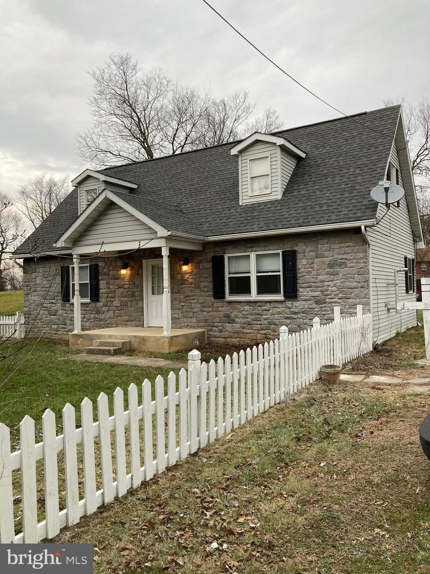 4 bedroom , 2 full bath Stone front Cape and all appliances convey!   full unfinished basement with built in storage shelves.  updated flooring on main level,  Living room features pellet stove with stone mantle with built in's.  Main level laundry hook ups.   fenced front yard and lot is just under an acre!   all kitchen appliances convey.   Stone front with vinyl siding.  Roof is newer!  short drive to restaurants and shops in  downtown Shepherdstown!