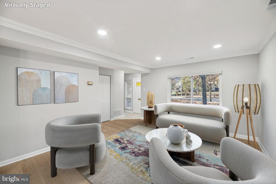 Welcome home to this brick end-unit townhome tucked into the established Glen Ora community of Greenbelt. Set on a quiet, tree-lined terrace, this two-level residence offers a comfortable 3-bedroom, 1.5-bath layout with generous living spaces, assigned parking, and access to sought-after neighborhood amenities. An inviting front entry opens into a spacious main level with a large living and dining area that easily accommodates everyday living and entertaining. The adjoining kitchen sits conveniently at the heart of the home, offering ample cabinet storage, practical counter space, and room to organize your favorite cooking tools, with an easy flow back toward the dining area for serving guests. A main-level powder room and multiple storage closets add to the functionality of the first floor.



Upstairs, all three bedrooms are grouped together on the second level, creating a separate, quiet retreat from the main living spaces. The well-proportioned bedrooms offer flexible options for a home office, guest room, or hobby space, along with a full hall bath and additional storage. With no basement to worry about, day-to-day living is streamlined across two finished levels, and the layout makes it easy to maintain the home and keep everything within reach.



Outdoor living is a key part of the appeal. Just beyond the main level you’ll find an outdoor space at the rear of the home that’s ideal for setting up a grill, a small patio dining set, or container garden, extending your living and entertaining area when the weather is nice. Around the community, mature trees, sidewalks, and well-kept common areas create a pleasant neighborhood feel and encourage daily walks or a quick stroll to the nearby amenities.



Residents of Glen Ora enjoy a strong amenity package at a very reasonable HOA fee, including use of the outdoor community pool, tennis courts, tot lots/playgrounds, and common-area lawn care, trash, and snow removal—giving you more time to enjoy your home and less time on exterior upkeep. Commuters will appreciate the convenient Greenbelt location with quick access to the Beltway, I-95, and the BW Parkway, as well as nearby Metro and bus options, putting major employment centers within easy reach, including NASA Goddard and the University of Maryland. Shopping, dining, fitness and recreation opportunities are all close by, including the Greenbelt Aquatic & Fitness Center, local parks, and neighborhood retail and services.



If you’re looking for an end-unit townhome with a sensible two-level layout, community outdoor pool access, and a convenient Greenbelt address, 8202 Canning Terrace is a must-see.