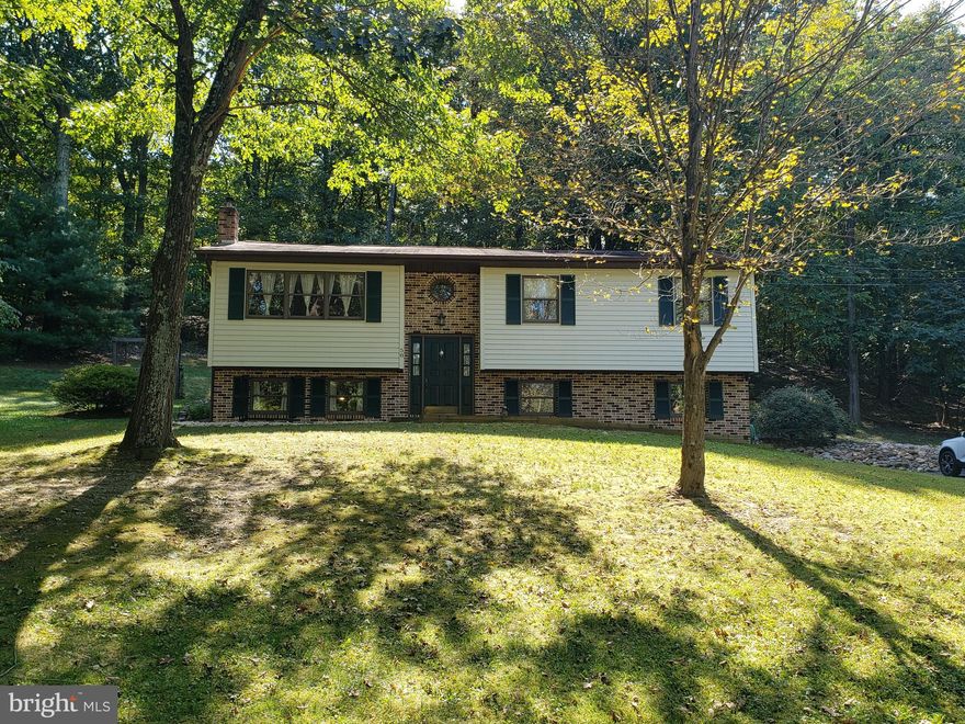 If privacy is what you are looking for, look no further. This move in ready split foyer home sits on 1.03 acres surrounded by trees yet close to all the conveniences. Also, don't forget about those low WV property taxes!! This home offers 3 bedrooms and 3 full baths. Hardwood floors in kitchen and dining area. 3 heat sources(heat pump, electric baseboard and a wood burning stove)and Central Air Conditioning. Make your appointment today to see this property.