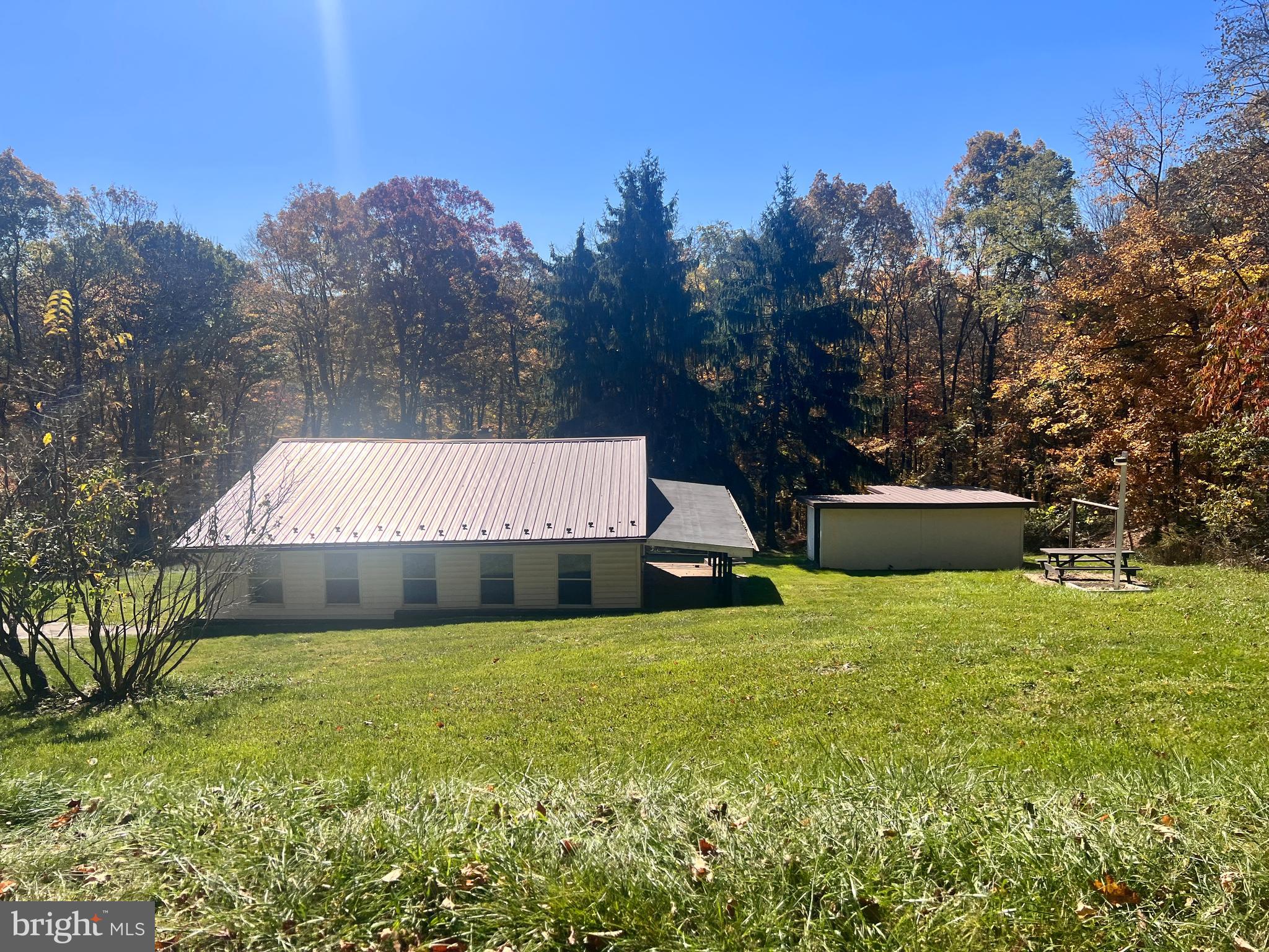 ACT NOW ***** BIG REDUCTION
As close as you can get to only man on the mountain at this price and on county maintained road. You are not alone, but less than a handful of neighbors around - but still not that far away to conveniences and services.
Newer metal roof, but needs new ceilings as damaged ones were demoed awaiting your new replacements. Updated forced air furnace with add on furnace. Sunroom/Enclosed porch. Covered patio. Outbuilding. Backs to woods. Don't wait too long or someone else will be the 'man on the mountain".
Sold as -is.
NO repairs before settlement.
Electric is on, but restoration or testing of any other systems, the responsibility/cost of buyer and operation not guaranteed; NO repair to make operational before closing not permitted.
Proof of funds or lender letter for as-is financing required.