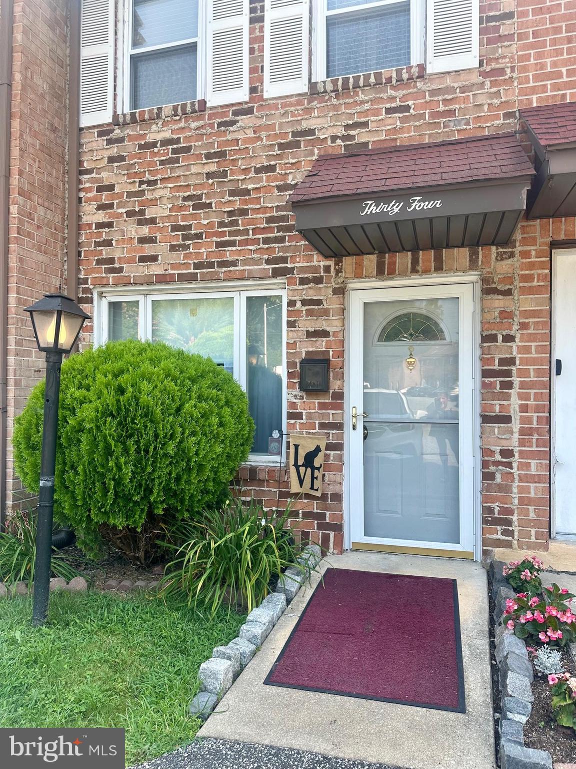 Adorable two story brick townhouse nestled in the Village of Greentree. This private community offers a low monthly HOA fee and assigned parking. Main level: Nice sized living room, powder room, a wonderful office/computer room, beautiful eat-in kitchen with updated appliances and sliding doors to outdoor living in the fenced-in patio area! 2nd level: Spacious primary bedroom with good closet space, hall bath w/laundry/ a walk-in tub and the second bedroom. A staircase from the primary bedroom leads to the floored attic which offers plenty of storage space. Convenient location near stores, eateries, public transportation, I-95 and the PHL Airport.