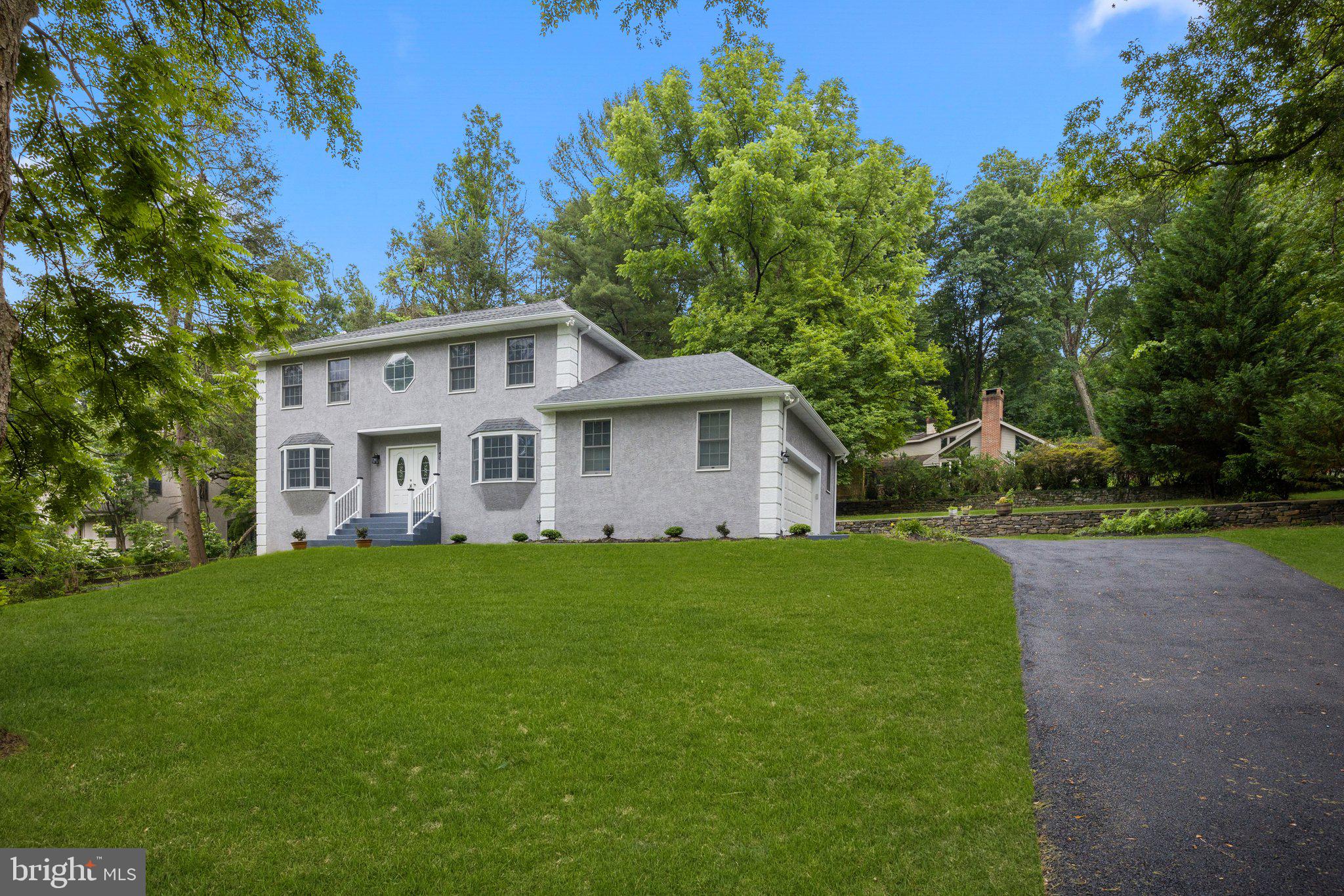 Welcome to your dream home in the Wissahickon Park G Neighborhood! Absolutely stunning 4 bedroom, 3 bath in the very desirable Lafayette Hill, PA. THERE IS ALSO ADDITIONAL LAND BACK OF THE HOUSE CAN BE USED AS A TENNIS COURT OR EXERCISE AREA. In this gorgeous home you will find Brand New upgrades. Completely remodeled with attention to details and some highlights are a Brand New Roof, New Driveway, New Walkways, Brand New European flooring, Modern Renovated bathrooms, Brand New HVAC System, Heat & AC Units installed along with newer hot water heater! The New gourmet kitchen with Trending Two Tone cabinetry, newer stainless steel appliances and Quartz, Calacatta countertops with Island and Amazing Backsplash! Open floor plan and large living room space. Nice size Bedroom on first floor, Two car garage with new Smart door openers and brand new huge Driveway!!! The huge partially finished basement offers a huge area. The backyard offers a Brand new Deck and great hardscaping. Recessed lighting throughout the house, custom trim & crown molding and much more. Enjoy the nature trails of Wissahickon Valley Park right in your backyard. Close to Morris Arboretum, Whitemarsh Valley Country Club and all the shops and restaurants Germantown Pike. This home is central and easily commutable with access to all major throughways! MAKE THIS YOUR NEW HOME TODAY!!