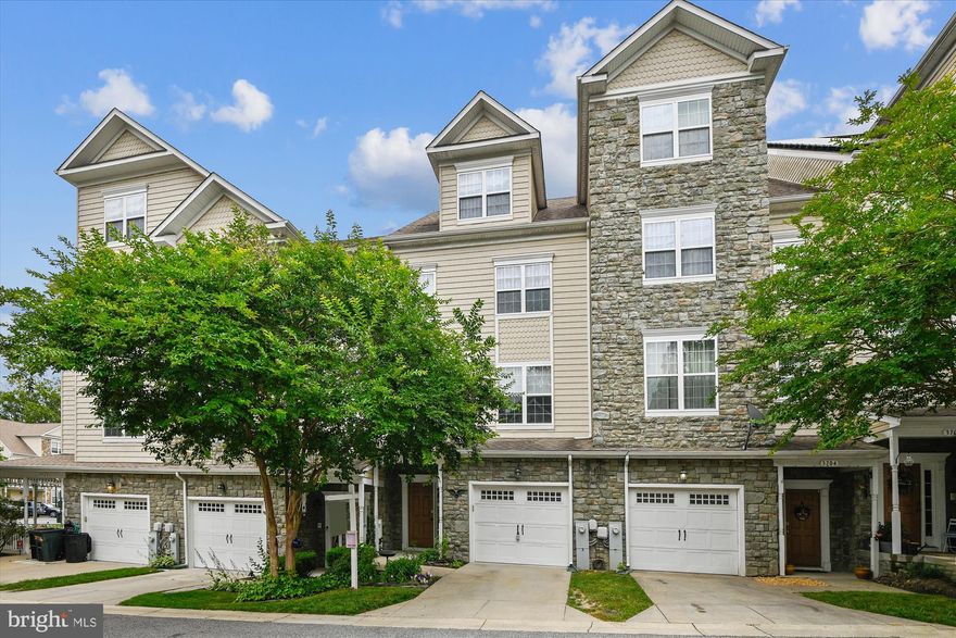 The best of North Beach "The Jewel of the Chesapeake"! See this beautiful, spacious townhome with 3 bedrooms, 2 1/2  baths on four levels with a large entertainment area on the entry-level and a one-car garage, and an additional driveway space for parking.   This home features a huge owner's suite and en suite bathroom with a large soaking tub and walk-in shower. New HVAC units with a 10-year transferable warranty. Beach activities and trendy restaurants are just a short walk away. In season, enjoy weekly farmer's markets, Friday evening street festivals, parades, and other public events throughout the year.  This is true hometown, waterfront Americana at its best.  Enjoy sunset walks along the boardwalk or drop a line in the water from the city pier or just relax on the beach.  The Calvert County Public Library is building its latest state-of-the-art branch near the waterfront. Find more restaurants, charter fishing boats, a waterpark, and boat slip rentals just a short drive away in neighboring Chesapeake Beach.