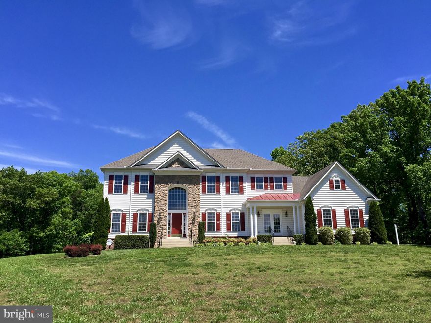 Colonial home, 8 plus acres, Somerset model by Quaker Custom Homes.The Somerset has approx 4,000 Sq Ft with 5 bedrooms  and 4 1/2 baths, Sunroom, Foyer, Powder room, Kitchen has granite countertops stainless steel appliances, There are 2 gas fireplaces, attached 3 car garage, full basement partially finished with a bath and bonus room. Property also features a 3 stall barn,fencing,paved driveway