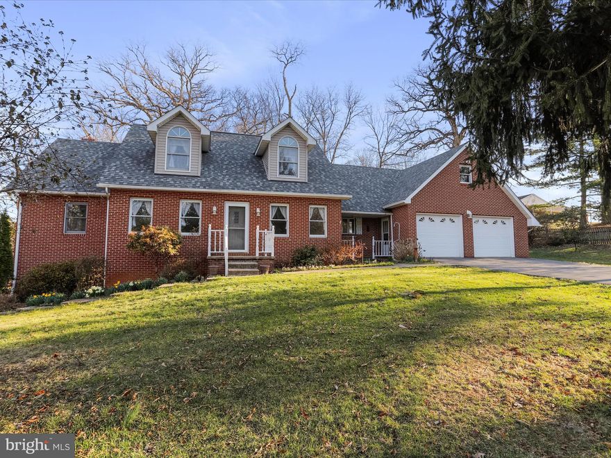 Stunning, custom built, large all brick cape cod on 1.29 unrestricted acres. Whether you have small livestock, are the outdoor enthusiast/gardener, or you are looking for a peaceful retreat (or all three!) this is it. This almost 4,000 sq. ft. home boasts 4 bedrooms/3 full bathrooms/1 half bathroom with the primary bedroom on the main level for easy one level living featuring private bathroom and large walk-in closet. Large kitchen has plenty of cabinet and useable counter space and lovely kitchen nook with beautiful bow window overlooking the back yard. Spacious living room opens up into a bright and airy sunroom just perfect for drinking your morning coffee and watching the wildlife go by. Separate dining room for all your entertaining opportunities. Formal sitting room with lots of natural light would make the perfect library, home office, or hobby room. The oversized garage has an attached bonus workshop ready to tackle any home project. Above the garage is a huge, unfinished area that can easily be finished off for more living space or keep it the way it is for plenty of extra storage and is easily accessible as a walk through on the second bedroom level with its own private entrance.  The nicely laid out second floor features three large bedrooms and full bathroom. Full, finished basement has a second equipped kitchen, a huge family room, half bathroom, and private side entrance. Fully fenced in back yard with large shed for storage. New architectural shingle roof July 2022. New central air conditioning unit October 2023. Outside city limits; no city taxes and no HOA.  Ideal commuter friendly location within 3 miles to I-70, less than 30 minutes to Frederick and the MARC train, and close proximity to both Pennsylvania and West Virginia state lines. This home truly checks off all the boxes. Don't miss your opportunity to own this gorgeous home and all the amenities that come with it. Schedule your showing today!