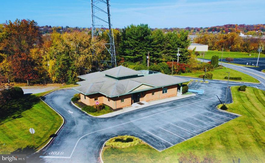 PAD SITE LEASE LOCATED 0.5 MILE TO ROUTE 30 and 10 MINUTES TO LANCASTER CITY.  Pad site has existing bank building with drive through (vault/safe inside has been removed). Welcoming full glass reception with vaulted ceiling in lobby, 5 private or semi-private offices, teller stations, break area, 2 restrooms, side employee entrance and covered drive through. Signage on Columbia Ave monument sign, and signage on the building will be visible to 15,000+ VPD. Monument sign at the pad site entrance faces Industry Drive. Tenant may use overflow parking in Western Corners Shopping Center. Any appropriate use is welcome including banks, offices, medical, food or beverage. Tenant may make improvements to building, drive through, parking areas, etc. Sq. Ft. does not include the drive through canopy. NNN Lease.