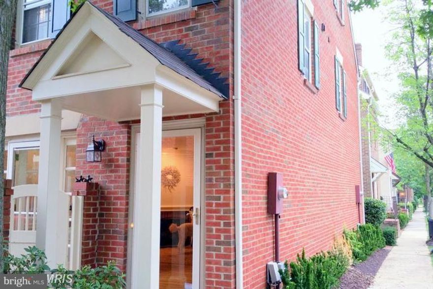 Nicely appointed end unit townhome in a sought after community. Wood floors, galley kitchen with brick patio courtyard off the kitchen. 3 bedrooms 3 levels, fireplace and very comfortable!  Easy access to shopping, restaurants and Route 1.  Quick drive to Reagan Airport