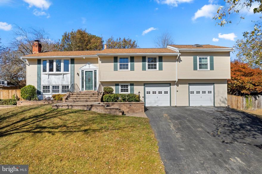 Step into this stunning, renovated home situated on a spacious .33-acre lot. Bathed in natural light, this beauty features hardwood floors sprawling across an open floor plan. The modern kitchen is a dream, boasting sleek grey cabinets, custom backsplash, ample storage, stainless steel appliances, and elegant pendant lighting—plus direct access to a deck overlooking the expansive backyard.

This home offers spacious bedrooms with the primary suite as a true retreat with an extra customizable sitting area, a luxurious bathroom with a stand-up shower, and double doors leading to the outdoors. The basement adds even more appeal, with a cozy fireplace, an additional bedroom, and a walkout to the backyard, providing plenty of space for guests or recreation.

Outside, enjoy the fully fenced, beautifully landscaped yard with a partially covered patio and a charming stone-built pond with a fountain. This home offers the perfect blend of indoor elegance and outdoor serenity—ideal for both relaxing and entertaining. Do not miss this opportunity!