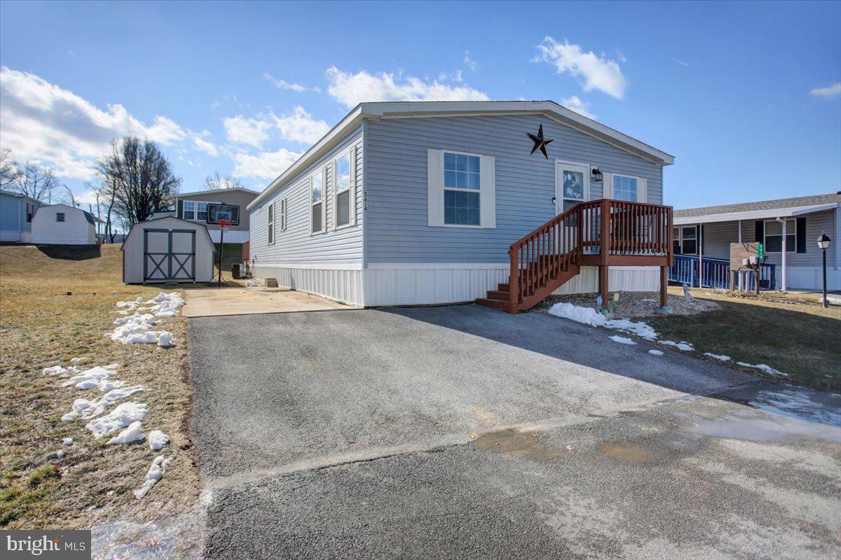 Welcome to this well-maintained 3-bedroom, 2-bathroom manufactured home offering comfort and convenience. The open-concept living area is perfect for entertaining, while the large primary suite boasts a spacious bathroom with dual sinks and a walk in closet. Step outside onto the back deck, ideal for relaxing or hosting gatherings. With ample natural light and a functional layout, this home is move-in ready! Don’t miss this opportunity—schedule your showing today!