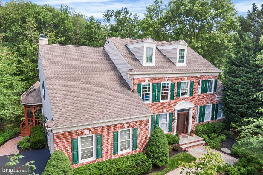 Welcome to 1090 Bancroft Ln, a beautiful brick colonial in desirable Wyndham of Yardley.  Situated on a quiet cul-de-sac, this premium lot backs to a wooded 5.3-acre conservation easement offering gorgeous views and ample privacy. Upon arrival, you will appreciate the extensive hardscaping and landscaping with landscape lights and in-ground irrigation system. Follow the bluestone walkway to the front porch with new front door and sidelights. The bright and airy 2-story foyer with turned staircase and hardwood floors is the perfect place to welcome guests. To the left is the study, an ideal home office. To the right is the expanded formal living room with gas fireplace and crown molding. The living room flows right into the expanded formal dining room with crown molding, creating a wonderful space for entertaining. The kitchen features oak cabinets, Corian counters, and stainless-steel appliances including a Bosch Dishwasher and Fivestar Dual Fuel Gourmet Range with 6 burners, grill/griddle, double oven, and professional hood with warming lamps. A 7’9” center island is the heart of the kitchen, and provides an abundance of counter space. The window over the sink offers views of the serene backyard and woods. You’ll find a filtered water dispenser at the sink for your convenience. The kitchen is open to the cozy family room with crown molding and floor-to-ceiling stone fireplace flanked by custom built-ins. The sun room with vaulted ceiling creates a perfect setting for informal dining, and offers gorgeous views of the backyard and preserved woods.  A sliding glass door leads from the sun room to the deck and screened-in porch with vaulted ceiling, skylights, and ceiling fan. There is a dedicated gas line to the deck grill (grill to be excluded). Stairs from the deck lead to a bluestone patio surrounded by mature, professional landscaping. Follow the bluestone stairs down to the beautiful and private backyard.  Back inside, you’ll find a laundry room with new tile floor, utility sink, and access to the 2-car garage. A powder room with pedestal sink completes the main level. Upstairs, you will find the spacious primary suite with sitting room and tray ceiling. The primary suite offers 3 closets (including 2 walk-ins), and a newly renovated ensuite bathroom featuring a double vanity with quartz counters, walk-in shower with seamless glass doors and rain showerhead, and a jetted tub with new tile and quartz surround. Three additional bedrooms upstairs share a newly renovated hall bathroom with tub/shower combo, double vanity and skylight. The partially finished lower level features a den with gas fireplace, recreation room with daylight windows, 5th bedroom with daylight windows, a full bathroom, and French doors that walk out to a paver patio. The unfinished portions of the basement include a workshop and an abundance of storage.  Additional storage includes a floored attic space (accessed through one of the primary walk-in closets), and an exterior shed/storage closet (accessed outside; beneath living room addition).  Lots of thoughtful upgrades have been made by these original owners, including a newer roof, 2 zoned HVAC with newer upstairs A/C, and a 75 gallon quick recovery water heater. Walk to LMT Community Center, LMT Pool, Kids Kingdom, Public Library, Softball and Baseball Fields, Bocce Ball Fields, Tennis and Basketball Courts and more.  Award winning Pennsbury School District. Easy access to US1 and I295 for commuting. Square Feet are approximate; Buyer is encouraged to verify. Listing Agent Related To Sellers.