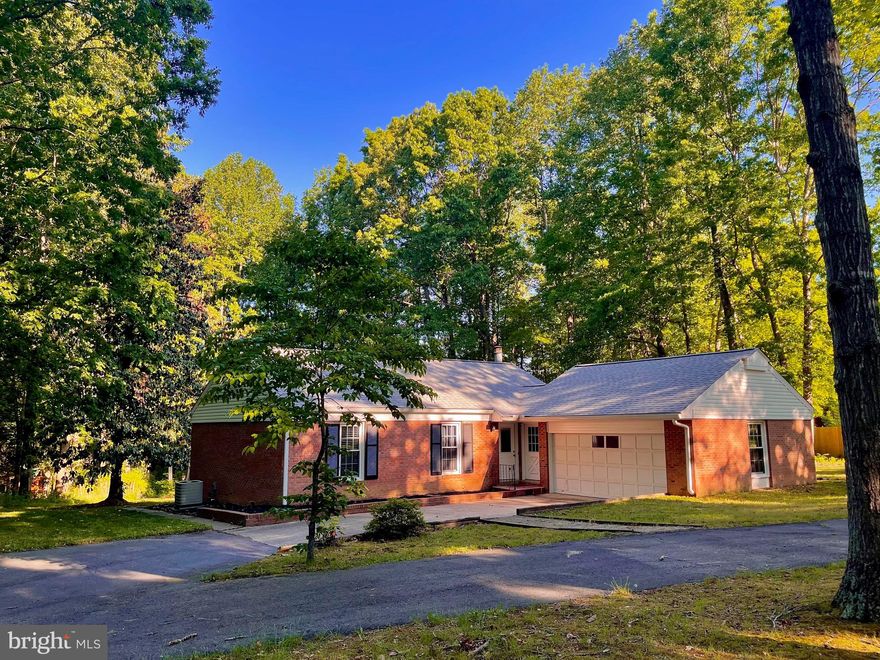 Don’t miss this one! —Completely Renovated and MOVE-IN READY; Just Turn the Key and Move Right In—**Private 1.26 Acres with Both Cleared and Treed Spaces w/Creek at Rear**Large Welcoming Front Yard with Extended Circular Driveway**3BR/2BA Home with Large Windows Allowing Tons of Natural Light**A Complete Renovation in 2019- NEW: White Kitchen Cabinets, SS Appliances, Granite, Light and Plumbing Fixtures, All New Flooring, Remodeled  Bathrooms**Shiplap Wall, Barn Doors 2020** Multi-Level Exterior Living with Deck and Patio Overlooking Private, Oversized Rear Yard**Oversized 2-Car Garage with Shelving and Work Area**New roof 2021**HVAC 2017**Water Heater 2018**New Neutral Paint 2022**Whole House Water Filtration System 2020**Washer/Dryer 2020**Front Door 2021**Garage has second washer/dryer hookups and vent if needed.