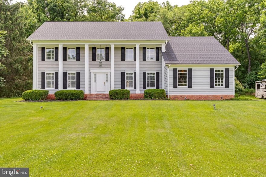 Big Price Drop! Take Another Look. This is your chance to be a part of this gorgeous Millpoint community!
This is a custom-built colonial, nestled on a beautiful  2.13-acre lot in the highly sought-after Mill Point neighborhood. Constructed by Tommy Graham, a name in the 80's and 90's synonymous with quality and attention to detail.  The lot is high and dry - not even any standing water the seller tells me. According to FEMA maps and Berkeley County Tax Records, this property is not located in a flood zone or designated flood hazard area.  Good to know! FYI -Risk assessments provided by Zillow and other sites are not based on FEMA or county records but rather on FirstStreet, a non-governmental organization partnered with American Family Insurance, as stated on their website.  So that's the outside -- and you'll love the  inside. As you enter, you'll notice  a nice size foyer and beautiful Bruce hardwood floors, which extend throughout the main areas. The interior features handcrafted wood crown molding, raised wainscoting,  an extra wide staircase, and solid cherry cabinets, things you don't often see in newer construction homes. The  layout includes a  first floor office accessed through a large french door, formal living and dining room and a  family room off the kitchen, anchored by a charming wood-burning fireplace with an optional gas hookup.  The kitchen is equipped with granite countertops, a stylish backsplash, and top-of-the-line appliances, including a newer oven, microwave, and a Jenn Air cooktop with griddle. The space is not only beautiful but also functional, featuring abundant closet space and a large attic for all your storage needs. An oversized two-car garage offers  benefits beyond simply housing your vehicles.  The extra width and depth allow for comfortable parking for two large vehicles and the flexibility to use  the space for other purposes, not just for parking cars. NOTE: There is a floored attic space with a light above the garage for plenty of storage.. Upstairs there's an expansive master bedroom, complete with an ensuite bath, plus 3 more bedrooms on that level.   Exterior features include a  brick sidewalk and a large back deck, a prvate setting ideal for entertaining or enjoying quiet evenings amidst nature.  

The location is second to none. Situated on the west side of I-81, this area offers the perfect balance of seclusion and convenience. The homes are set on larger lots, creating a sense of  privacy that is hard to find so close to the city.  Don't be surprised when the occasional deer wanders through your yard, yet you're just 5 minutes away from the major shopping areas in Martinsburg. The Mill Point subdivision is renowned for housing some of the finest homes in the area, making it a highly sought-after neighborhood. This blend of tranquility and accessibility makes it an ideal place for those looking for the best of both worlds.  This home is a rare find for those who value quality construction and an eye for detail. 
So, Don't miss the chance to own a piece of Mill Point's finest.  Take a look and make an offer.