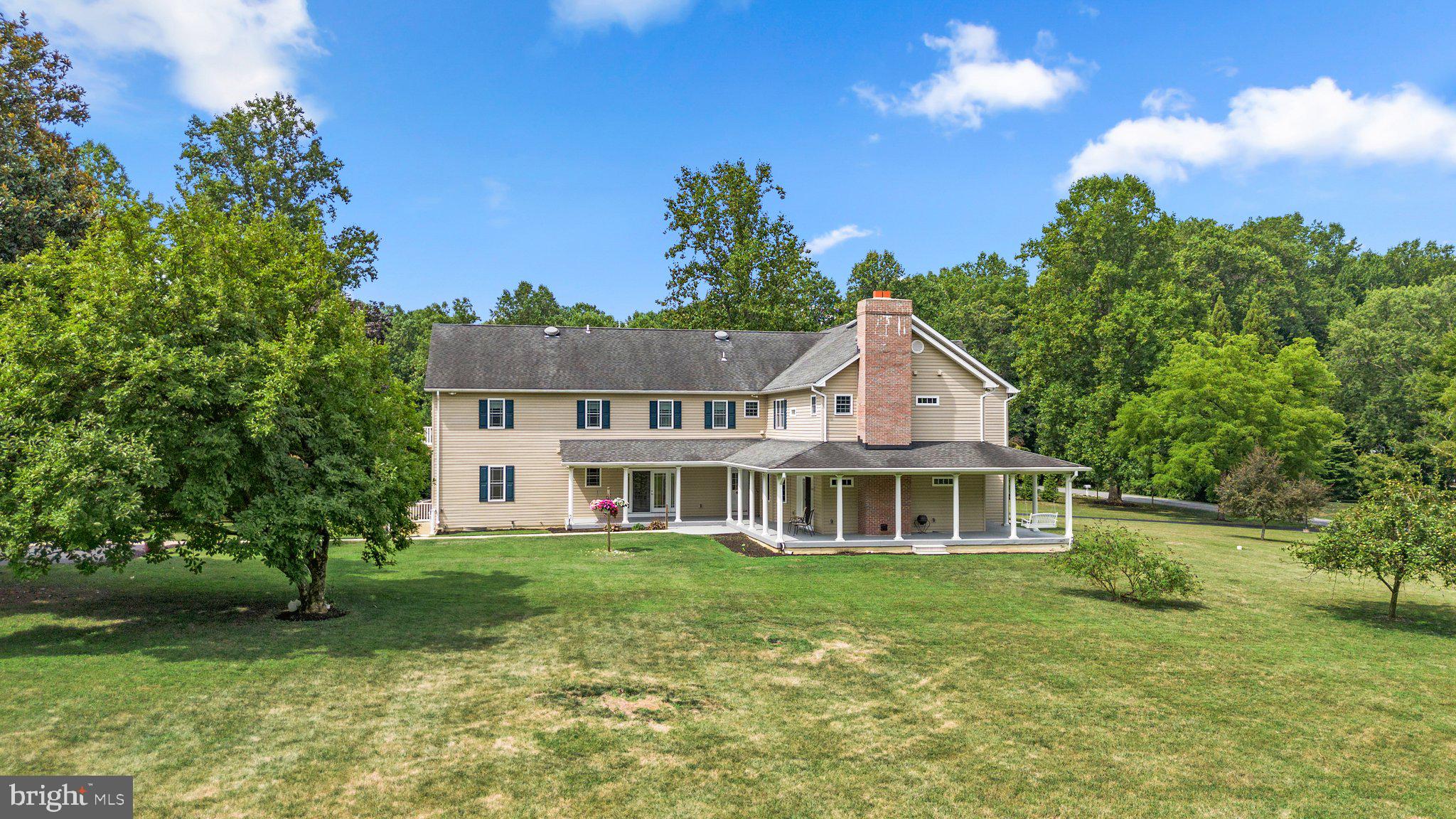 UNIQUE OPPORTUNITY TO OWN AN OUTSTANDING PROPERTY NOW AVAILABLE IN SOUGHT-AFTER HOWARD COUNTY. THIS MULTIGENERATIONAL HOME IN A COVETED FULTON COMMUNITY OFFERS AMPLE ROOM WITH APPROXIMATELY 6600 SQUARE FEET OF FINISHED LIVING SPACE. ESSENTIALLY TWO HOMES CONNECTED TOGETHER. THE HOME WELCOMES YOU WITH GLEAMING HARDWOODS THROUGHOUT THE FORMAL LIVING ROOM AND DINING ROOM, WHICH SHARE A GAS FIREPLACE. FROM THERE, YOU'LL FIND A GOURMET KITCHEN WITH STAINLESS APPLIANCES AND STUNNING GRANITE COUNTERTOPS, A BRIGHT OFFICE, AN OPEN FLOOR PLAN FAMILY ROOM, A MUD ROOM, AND A HALF BATH. THE SECOND LEVEL INCLUDES 4 LARGE BEDROOMS, A LAUNDRY ROOM, AND 3 FULL BATHROOMS.
THE CONNECTED IN-LAW SUITE INCLUDES TWO MAIN-LEVEL BEDROOMS, ITS OWN LAUNDRY AREA, A SITTING ROOM, A GREAT ROOM WITH A TRIPLE-SIDED GLASS FIREPLACE, A HALF BATH AND AN EAT KITCHEN. INCLUDES A LARGE SECOND-FLOOR PRIMARY SUITE WITH GAS FIREPLACE, WALK-OUT PORCH, AND LARGE FULL BATH WHICH COULD BE USED BY EITHER THE PRIMARY HOUSE OR SECONDARY SUITE.
THE PARTIALLY FINISHED BASEMENT OFFERS AMPLE STORAGE WITH 3300 sq/ft AND 9.5 ft ceilings. THIS SPACE OFFERS AMAZING OPPORTUNITY TO BE FINISHED WITH TALL CEILINGS AND PRE-PLUMBING FOR HEATED FLOORS!
ENJOY FRESH AIR OVERLOOKING 3 ACRES OF LAND FROM THE MASSIVE WRAP-AROUND PORCH AND DECK. THE PROPERTY ALSO INCLUDES A GARDEN-SHED, HUGE 4 CAR DETACHED GARAGE THAT INCLUDES AN OVERSIZED MOTORHOME GARAGE. THE RV GARAGE IS 16’x 40’ FT AND IS EQUIPPED WITH 30 AND 50-AMP ELECTRICAL HOOK UPS AND SEWAGE DUMP STATION.
THIS HOME OFFERS SO MANY OPPORTUNITIES FOR THE BUYER SEEKING A MULTI GENERATION SPACE, A HOME BUSINESS, A COLLECTOR, AND ENTHUSIAST, ETC. THESE OPPORTUNITIES DO NOT COME OFTEN.