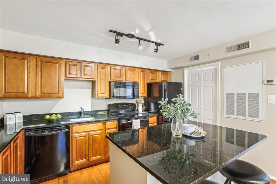 Commuters Dream with easy access to route 7 and one light to 395  or better yet take the daily shuttle to the  Pentagon metro.  So,  why rent when you can buy this nicely appointed 1 bedroom, 1 bath condo at the Pointe at Park Center - gated community in Alexandria.  This quaint condo has everything you need to make yourself at home - rich looking cabinets with black granite counters and matching appliances.   Amenities galore - pool, fitness center and community room are just a few steps away.  Dedicated parking space, great view of the pool from the private balcony and lots of shopping and restaurants nearby.   Open House Sunday 1/28 2 pm - 4 pm.  Stop by.