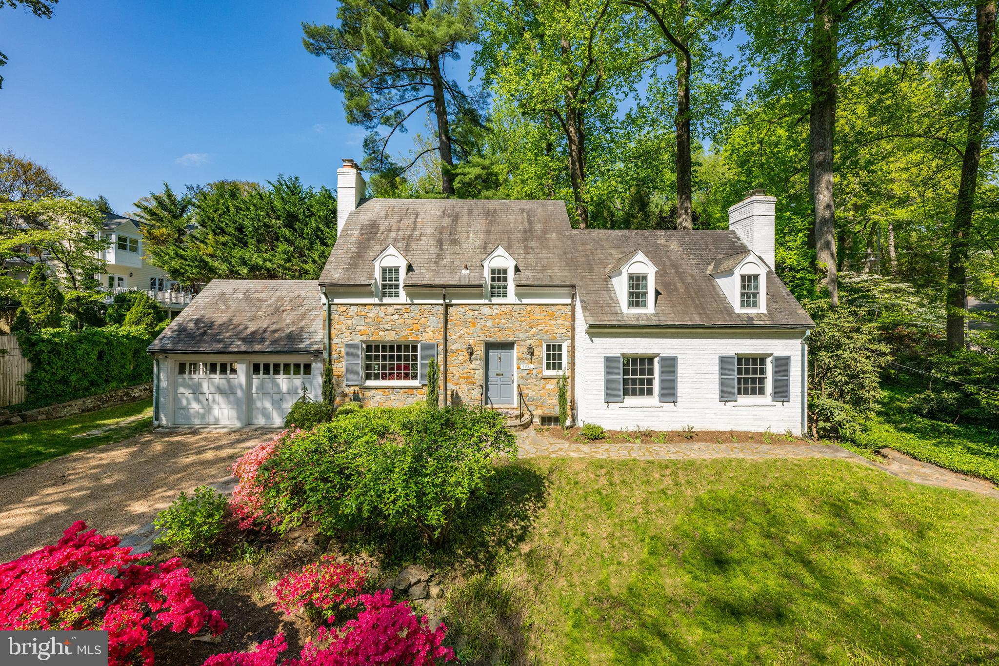 This beautiful three bedroom cape exudes old English charm and is situated on a private corner lot in the highly sought-after Westmoreland Hills neighborhood. The exquisite exterior with stunning stone facade, complements the spacious interior featuring hardwood floors, oversized windows, and stunning millwork. The main level boasts a gourmet kitchen with stainless steel appliances, an elegant dining room with access to the back patio, and a formal living room and family room with fireplaces and custom built-ins. The upper level offers three bedrooms and two full bathrooms, including the luxurious primary suite with a custom walk-in closet and a spa-like bathroom with a walk-in shower. The walk-out lower level features an oversized recreation room with a fireplace, an additional bathroom with a soaking tub, and a laundry room. Completing this home is a private rear patio, two-car garage, and pea gravel driveway with parking. The home is located just steps from Westmoreland Hills Park and has direct access to Little Falls and Capital Crescent Trails. Starbucks, Millie’s, and the Spring Valley Shopping Center are just up the road!