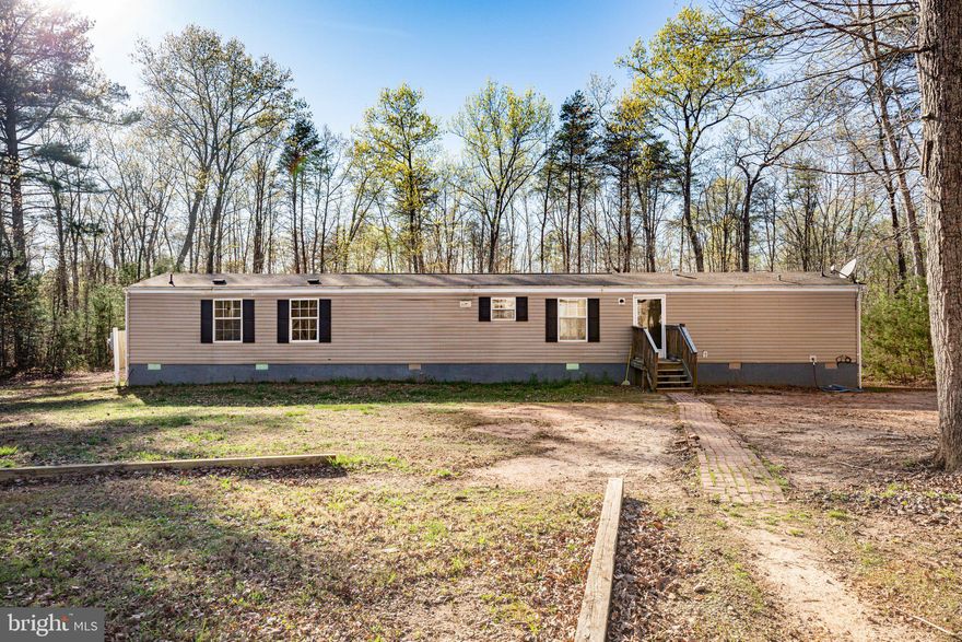 Situated on a perfect 13.44 acre lot ideal for the great outdoorsman. This spacious 3 bedroom 2 bathroom home boasts over 1216 sq ft. of living space. The home has been upgraded 2018 and has brand new flooring in the living room, wall to wall carpeting more. The huge Master Bedroom with master bath and walk-in closet is move-in ready. Gigantic Detached garage with potential for heat that can be used as a hobby shop. Must see.