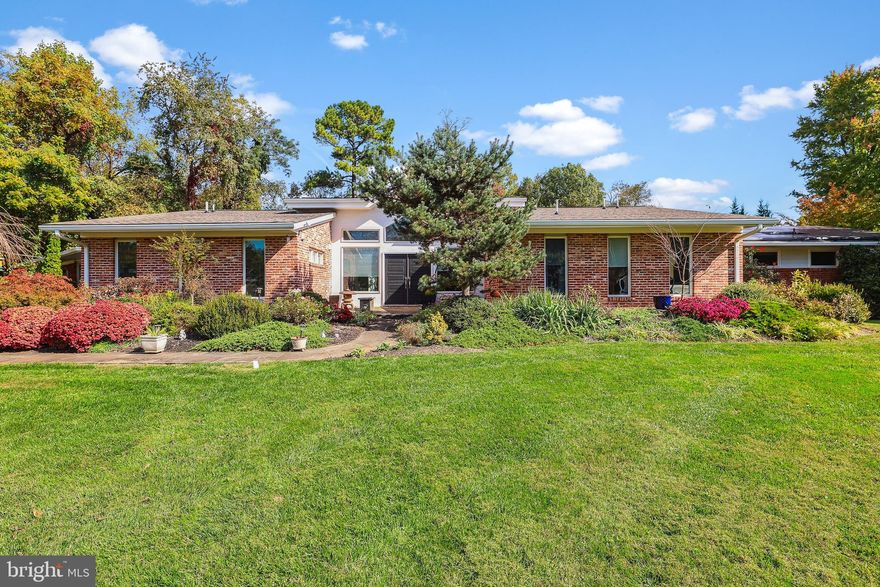 Welcome to 9111 Cherbourg Drive.  This expansive home features one level living with over 5,600 sq/ft of finished space.  Perched atop a a private 1+ acre lot, this expanded and redsigned home offers a spacious and flexible floorplan for both daily use and entertaining.  Bright and open, each room allows for abundant daylight and spectacular views of the professionally landscaped gardens. The updated chef’s kitchen includes top of the line stainless steel appliances, custom backsplash, breakfast area and plenty of storage.  The adjoining family room is the perfect gathering place for family and guests to relax.  The formal living and dining rooms boast gleaming hardwood floors, recessed lighting and a stone feature wall of the wood fireplace. The primary bedroom includes an en-suite sitting room and luxurious primary bath including custom tilework, a free standing tub and tankless water heater. There are 4 additional guest bedrooms, one with en-suite bath and 2 additional full baths.  The property also offers a professional/home office with private entrance, an indoor lap pool and adjacent studio/fitness room. The surrounding grounds are a tranquil retreat with a paver stone rear patio, English garden with perennial plants that bloom throughout each season.  You won’t want to leave!  Ideally located in the Lake Normandy Estates subdivision, the Churchill school district and just blocks from major houses of worship and easy access to major commuter routes, shopping and more!  New roof 2023 and recent updates of HVAC systems. Don’t miss!