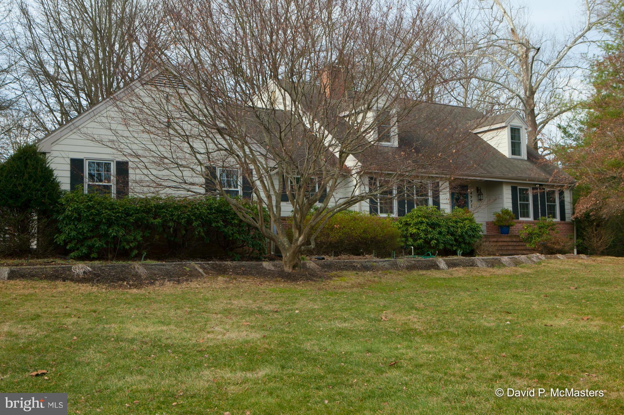 Set in the middle of almost 10 park like ac's, an attractive Cape Cod has been EXPANDED, FULLY UPDATED + RENOVATED. It now has 4,000 SF of room, a gourmet kitchen, a full basement apt, + a detached nice OFFICE BUILDING. grounds are gorgeous;9.7 acres of meadows, woods, big stream, big trees + springs.Huge LR, big deck, 2 Master BR's, 1 1st floor + 1 huge.Very private, great location! HAS IT ALL.