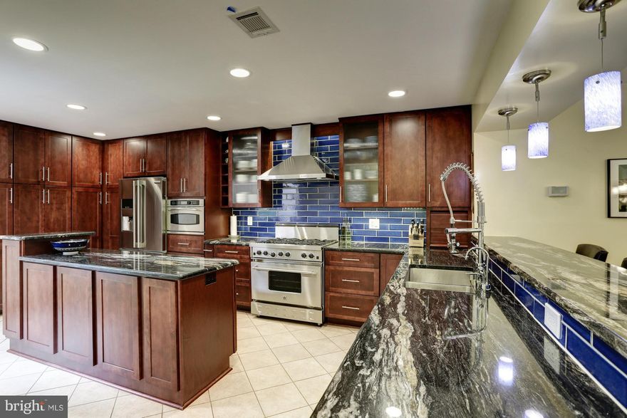 Best value in WHITMAN cluster! OPEN CONCEPT, hardwoods, 3+ beds, wooded views, garage, 2 fireplaces. Chefs 15K BTU 6 burner GAS range, 2nd convection oven/micro, granite. MASTER SUITE walk in closet, dual head shower, soaking tub, double granite vanity. Upgrades throughout: windows, siding, deck, carpet. Walk to GREAT FALLS, bike to POTOMAC VILLAGE, easy DC/MoCo/NoVa commute.