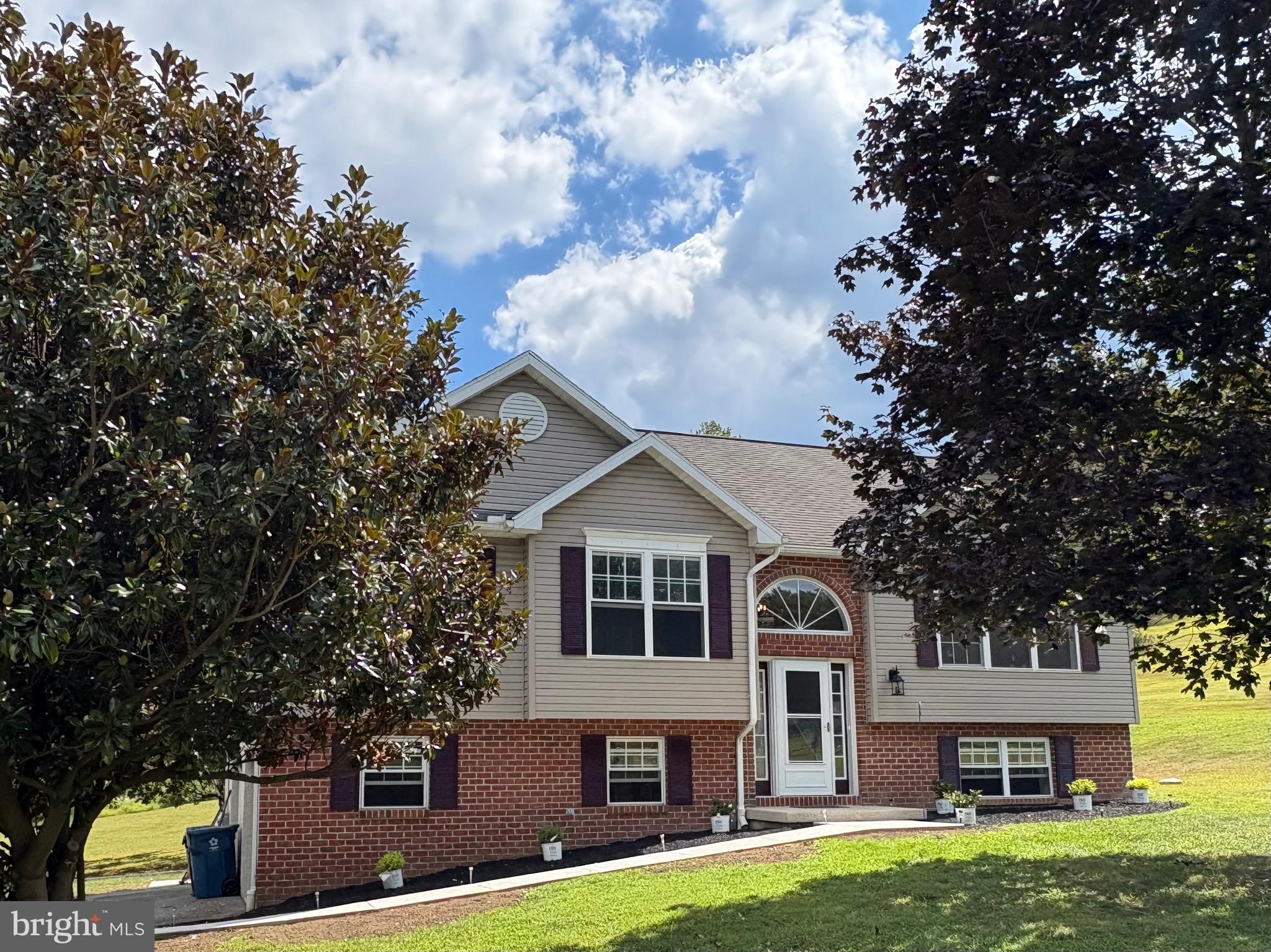 Welcome to this beautifully updated bi-level home located in the highly sought-after Unionville-Chadds Ford School District. Offering 3 bedrooms, 2.5 baths, and fresh updates throughout, this home combines comfort, convenience, and style. Step inside and head upstairs to a spacious family room, dining area, and a bright kitchen featuring an island breakfast bar. A sliding door opens to a brand-new deck overlooking the serene and private backyard—perfect for outdoor dining or entertaining. Down the hall, you’ll find the primary suite with en-suite full bath, along with two additional bedrooms served by a shared hall bathroom. The lower level features an open, versatile space ideal for a second living area, office, or playroom, complete with a powder room, laundry, and sliding doors that walk out to the expansive backyard. A two-car garage and separate storage shed provide excellent storage options. Freshly painted with new flooring, this home is move-in ready. Lawn care and snow removal are included, allowing for easy living year-round. Ideally situated near major travel routes, West Chester and Kennett Boroughs, as well as parks and hiking trails, this home offers the perfect balance of convenience and tranquility.