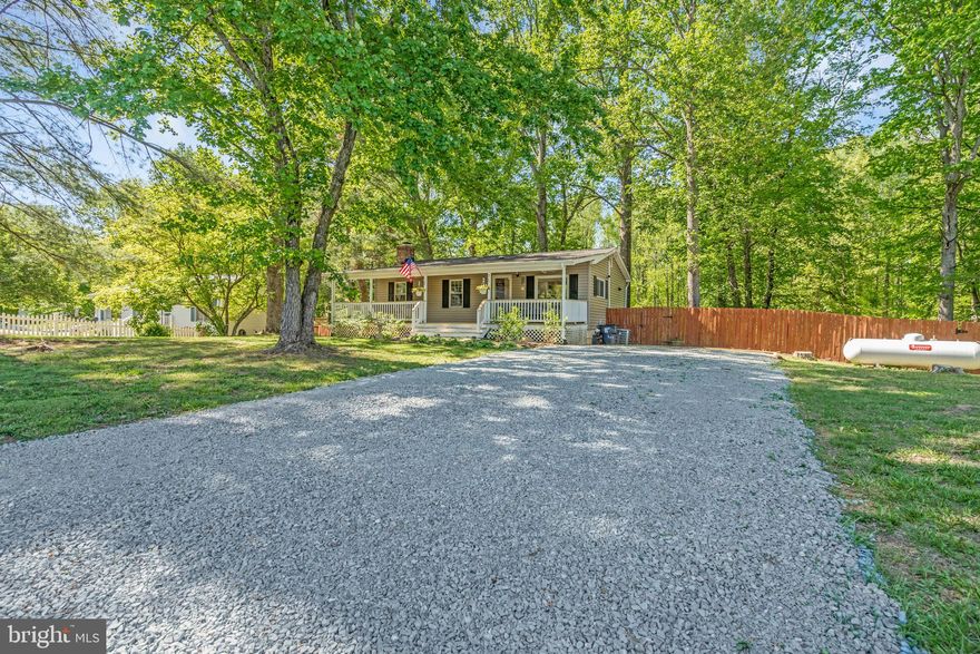 *                                Charming Home in Quiet Lake Community – Walk to the Water!                                                          *

Welcome to your peaceful retreat in a beautiful, tree-filled lake community! This inviting 4-bedroom, 2-bath home offers the perfect blend of comfort and outdoor living. The heart of the home is a pretty kitchen with a lovely view of the fully fenced backyard—ideal for kids, pets, or just enjoying a quiet morning. Step outside onto the spacious back deck, perfect for entertaining or relaxing under the trees.

Inside, the cozy living room features a wood-burning stove that adds warmth and charm throughout the cooler months. Just a short walk from your front door, the lake awaits! Spend your days kayaking, fishing, or simply taking in the serene water views.

Tucked in a quiet neighborhood known for its natural beauty and friendly vibe, this home is a rare gem that offers tranquility and convenience in one. Whether you're looking for a weekend getaway or a full-time residence, this one is a must-see!
No HOA dues !  Located in the Mountain View HS district .    Just off of Rt 610- Garrisonville Rd - the first exit south of Quantico off of I-95

Attn: First Home Buyers.   Be sure to ask about Special No Down Payment Financing and  Down Payment Assistance Grants.