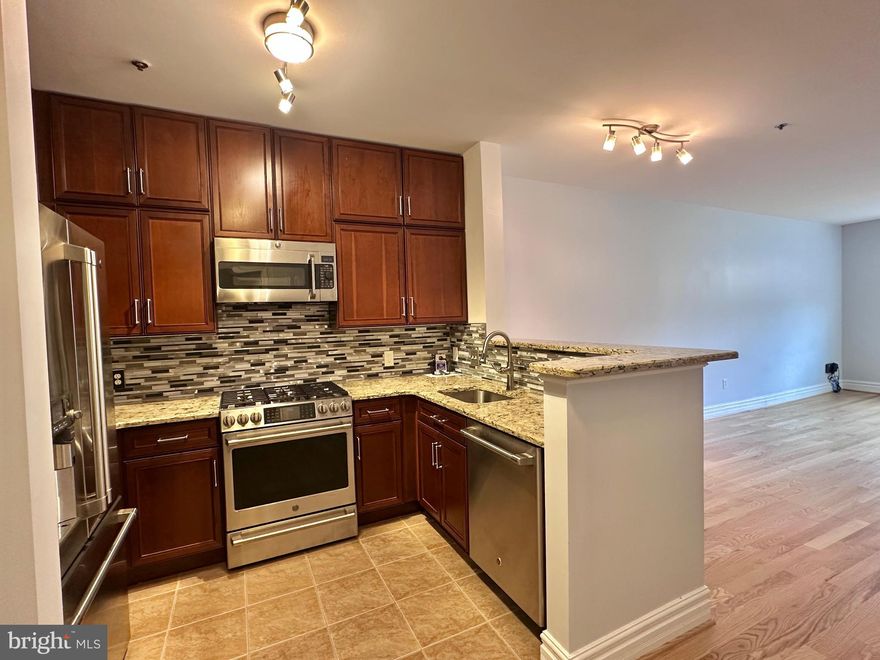 This 1-bedroom apartment has a prime location right by Tysons Galleria, Capital One, and the Greensboro and Spring Hill metro stations! Located within the triangle formed by 267 (Dulles Toll Road), Leesburg Pike (7), and 495, living here means being able to get anywhere very easily - you don't even need a car with how close by public transit is! The kitchen has stainless steel appliances, including a gas stove with 6 burners, a built-in microwave, dishwasher, and a fridge that has a Keurig attachment as well as a water and ice dispenser. The bathroom, which can be accessed from both the living area and the bedroom, has a tub/shower combo with beautiful tiling and fixtures. The private balcony can be accessed from both the bedroom and the living area. The community has a game room, gym, and pool. This unit is perfect for any individual/couple who values convenience, open floor plans, and accessibility! Schedule your tour today. Comes with 1 reserved parking spot. One-time move-in fee of $550 (which reserves elevators for move-in day), due to the community association.