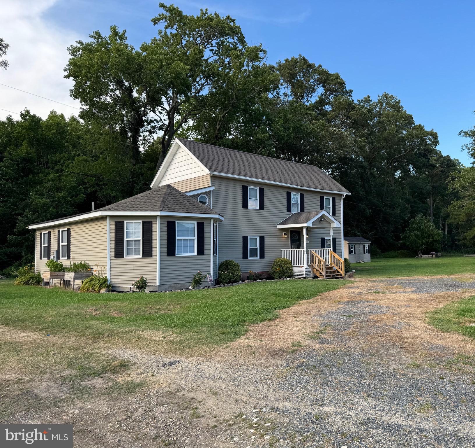 **Professional Photos to Follow!**
Looking for quiet country living? You’ve found it on Farm Market Road, just minutes from the quaint town of Crisfield. This recently renovated home sits on a large lot, offering peaceful surroundings where you can relax on either of the two porches and watch the deer roam by.
Inside, you’ll find all-new flooring, throughout including plush carpeting in the bedrooms, as well as fresh modern paint throughout. Energy-efficient double-hung windows and a newer roof help keep heating and cooling costs affordable year-round.
The spacious, eat-in kitchen features beautiful cabinetry, granite countertops, along with stainless steel appliances, including a range, refrigerator, and built-in microwave. A large formal dining room provides the perfect space for hosting guests.
The first-floor primary suite offers privacy and comfort with a full bathroom that includes a walk-in shower and relaxing jacuzzi tub. Upstairs, you’ll find two generously sized bedrooms and another full bath with a shower/tub combo.
Enjoy outdoor living with both a front and rear patio — ideal for entertaining or simply enjoying the peaceful country views. A storage shed on the property provides extra space for tools, lawn equipment, or hobbies.
If you’re ready for a quiet retreat with modern updates and room to roam, schedule your showing today and experience this piece of serenity for yourself!