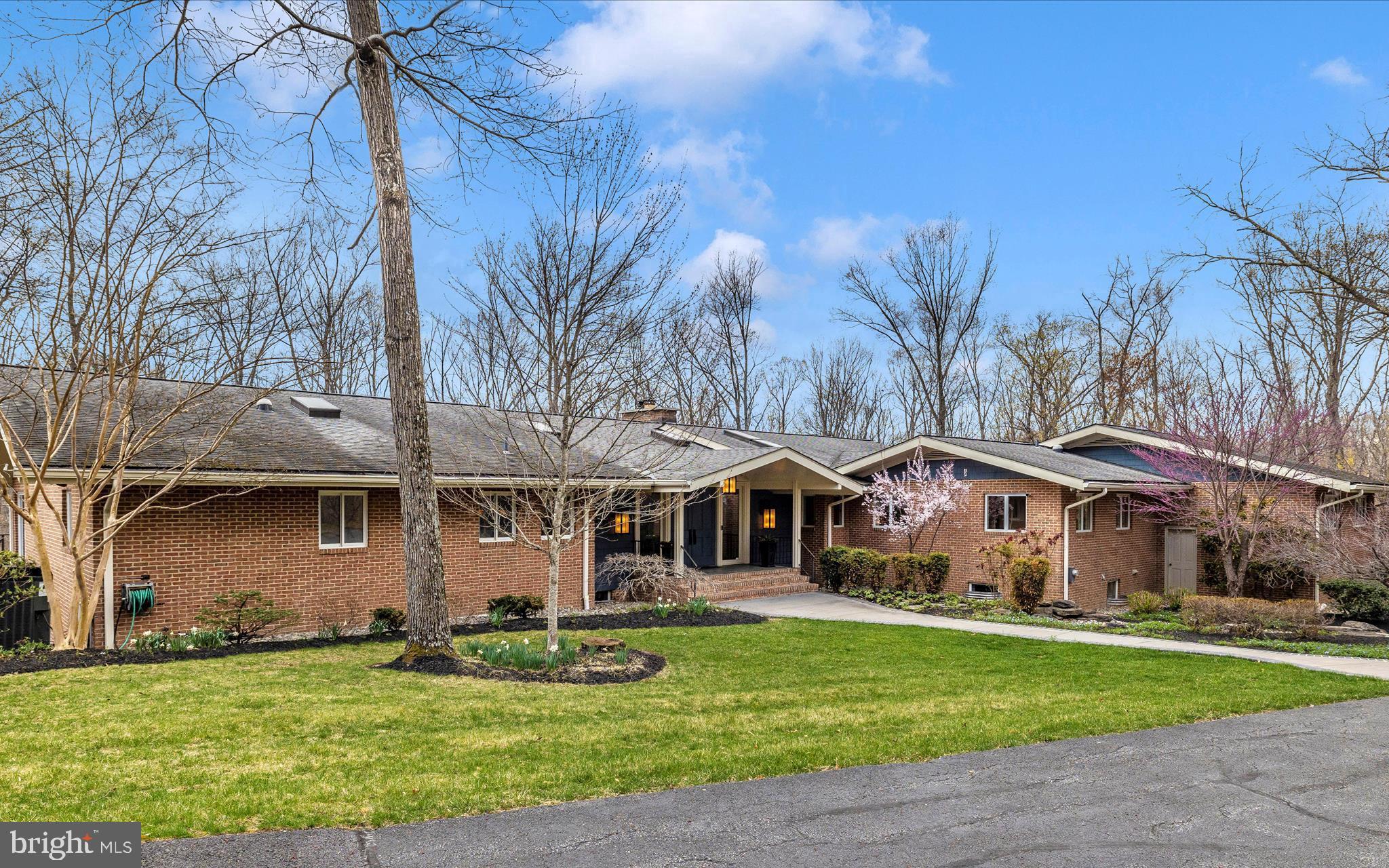 Stunning, midcentury modern rancher nestled on almost 25 wooded acres. This exceptional, private oasis is conveniently located minutes from downtown Frederick, Wegmans and major commuter routes. Perfect home for relaxing or entertaining. Your own private retreat features almost 8,000 square feet of finished living space plus in ground pool, multiple patios, wrap around deck, outdoor fireplace, fountain and lush, professional landscaping. Imagine the possibilities! Expansive entry foyer welcomes you to this spectacular home showcasing vaulted great room with with beamed ceiling, wood burning fireplace and full length, rear windows overlooking private woodland. Gourmet kitchen with professional grade, Thermador appliances, leathered granite, peninsula island and walk-in pantry. Breakfast room with wet bar, sky light and separate sitting area with built-in cabinetry. Kitchen opens to formal, vaulted dining room. Screened porch, wrap around deck and paver patio with stone fireplace provides great outdoor entertaining space. 3-car garage opens into the family foyer featuring two spacious closets, full bathroom, laundry room, entrance to kitchen double pocket doors and back staircase to lower level. Vaulted office with built-in shelving and skylights. Spectacular primary suite features spacious bedroom, en-suite luxury bathroom with custom walk-in closet and separate, private den/sitting room. Fully finished, walk-out lower level features family room with built-in cabinetry, surround sound, fireplace (gas insert) and kitchenette. Family room opens to pool and provides an ideal entertaining space. Lower level half bath conveniently located off family room can also be accessed from exterior for pool use. Lower level also includes 3 bedrooms with en-suite bathrooms, 2 additional bedrooms with shared bathroom, exercise room, wine room, workshop, and storage room.