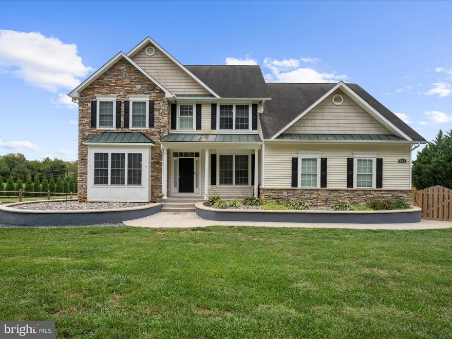 Come see this one of a kind home located in the community of Union Bridge! This beautiful home sits on a 2 acre lot with spectacular views and quiet surroundings. Home has a fenced in front yard perfect for pets. along with a wrap around flower bed with stone accent. Inside boasts beautiful hardwood floors. First floor office equipped with French doors, 9 ft ceilings, large kitchen that features 2 refrigerators and ovens, Gorgeous sunroom with plenty of natural sun, covered deck with ceiling fan, living  room has a recessed tv nook along with pellet stove, High hat recessed dimmable lighting throughout the house, mud room with large sink basin. Basement includes a great room equipped with a bar/ double sink along with granite countertops and French doors. 2 additional rooms in the basement - one of the rooms is suited for a sauna with a dedicated circuit, the other is a larger bonus room.  Beautiful paver stoned walkway lining the backyard. Backyard is flat with exceptional views and lots of possibilities! Large parking area for multiple vehicles, perfect for entertaining. Don't miss out on the opportunity to own this home!