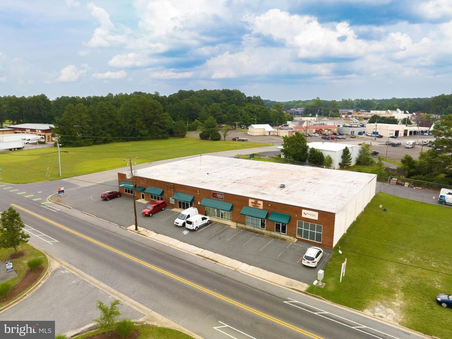 SEE VIDEO WALKTHROUGH  UNDER VIRTUAL TOUR SECTION- Space will be available July 1st or possibly earlier.
The Unit 106 space is in excellent condition as it was newly refinished 3 years ago. The property has C-1 General Commercial zoning, the widest category in Salisbury, that allows for a huge variety of uses. The property has BOTH drive-in AND shared dock-high access with secured gated fence access at the rear that allows for tractor-trailer loading and unloading. There are two loading docks on a common corridor. Fenced & paved rear parking area yard with an automatic gate and ample on-site parking area yard with an automatic gate and ample on-site parking.

 Space is fully conditioned & layout is flexible. It can be configured as primarily office, service-manufacturing, or warehouse depending on tenant preference.  The property has C-1 General commercial zoning, the widest category in Salisbury, that allows for a huge variety of uses. There is a full property brochure available in the documents section. Ask the listing agent or your agent for a copy.

Highlights
- High-quality industrial-service neighbors
- 2 Position Loading Dock
- Fenced Yard for added security
- Conveniently located one block from Route 13
- Within the Wicomico County Enterprise Zone
- Versatile flex building for office and warehouse use