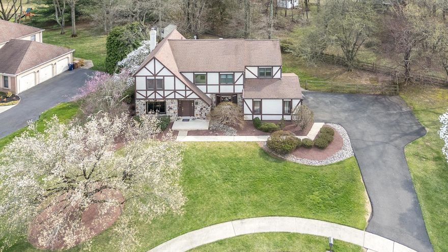 Be prepared to be impressed!  Welcome to this inviting four bedroom home, tucked away on a quiet cul-de-sac in the highly sought after Dublin Chase community and located within the award-winning Upper Dublin School District. Thoughtfully designed for both everyday living and entertaining, the home offers a spacious and comfortable layout filled with natural light.  The living room provides a bright and welcoming space and flows seamlessly into the expanded great room, enhancing the home’s open and airy feel. A formal dining room, features a beautiful bay window and comfortably accommodates large gatherings, making it ideal for holidays and special occasions.  The enlarged great room and adjacent kitchen form the heart of the home, filled with abundant natural light from oversized windows that create a cheerful and inviting atmosphere. Cozy up by the beautiful stone gas fireplace, complete with hearth—perfect for relaxing evenings at home. surrounded by  custom built-ins, and expansive windows that anchor the space beautifully. The updated kitchen is a true standout, offering soft-close cabinetry, granite countertops, a center island, stainless steel appliances, tile backsplash, and a spacious pantry. A sliding glass door leads to the backyard oasis, where a serene paver patio provides the perfect setting for outdoor dining or relaxing in the sun.  A flexible main level space offers options for a home office and mudroom/laundry area and features excellent closet storage. A convenient powder room completes this level.  Upstairs, the generously sized primary suite features a walk-in closet, laundry chute, and an adjoining sitting room. The en-suite bath includes a whirlpool tub, separate shower, and skylight. Three additional well-proportioned bedrooms and a hall bath complete the upper level.  The finished lower level provides exceptional additional living space with a large recreation room with bar, exercise area, a workshop  with built-in workstation and a cedar closet. Additional highlights include a two-car garage with Tesla charging station,  HVAC and hot water heater replaced in 2022, recessed lighting throughout much of the home, newer laminate flooring,  new carpeting on stairs and second level, ceiling fans, powder flush toilets, fencing, and the exterior stucco has been painted and sealed in 2022. This home offers a thoughtful blend of comfort, functionality, and updates in a prime location.  Located within the top-rated Upper Dublin School District, the community is served by two newly built, state of the art schools—Upper Dublin High School and Sandy Run Middle School. Just minutes from shopping, dining, the Promenade, Life Time Fitness, Mondauk Park, Trader Joes, nearby train stations, and major commuting routes.  This home delivers outstanding convenience in an exceptional setting.