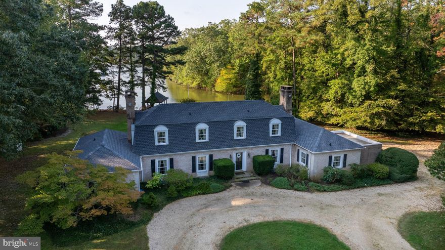 This stunning waterfront property offers a serene lifestyle with a spacious 3-bedroom main house, each bedroom featuring its own en-suite bathroom, including a convenient main-level suite. Enjoy breathtaking water views from most rooms, whether relaxing in the formal or casual living and dining areas. The home features hardwood floors in many rooms including a few under the carpets. The grounds are green and lush and include a waterside concrete, in-ground pool perfect for entertaining. The property also includes a bulkheaded waterfront and a boathouse on Shipshead Creek. Attached 2-car garage and a garden shed provide for abundant storage. Situated on 3.3 acres off St. Michaels Road near Easton, it also features a charming two-bedroom guest house, making this a perfect retreat for family and friends.