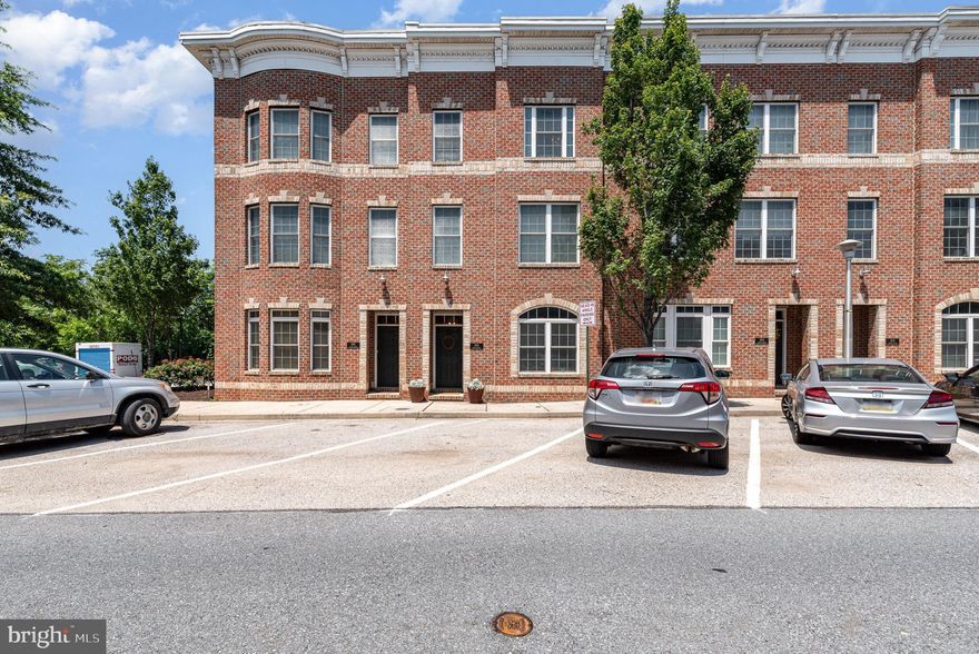 Welcome to this incredibly maintained, custom townhome in the heart of Locust Point. This spacious 4-bedroom, 2 full bath, 2 half bath home combines style, comfort, and unbeatable walkability in one of the city’s most sought-after neighborhoods. Step inside to an open-concept living, kitchen, and dining area, featuring custom built-in bookshelves, a natural gas fireplace with a removable custom mantle, granite countertops, custom cabinets, and plenty of space for both relaxing and entertaining. The kitchen is thoughtfully designed with a new refrigerator, new dishwasher, and a wine refrigerator. Additional highlights include: brand new HVAC systems (May 2025), new tankless water heater (2024), main-level washer and dryer, alarm system for added security, 2-car garage with private access, and excellent sound insulation between neighbors for a quiet retreat. All of this is just steps from restaurants, grocery stores, banks, dry cleaners, shops, schools, Fort McHenry, Latrobe Park, the harbor, and more.  Top it all off with panoramic harbor views from your private rooftop deck.