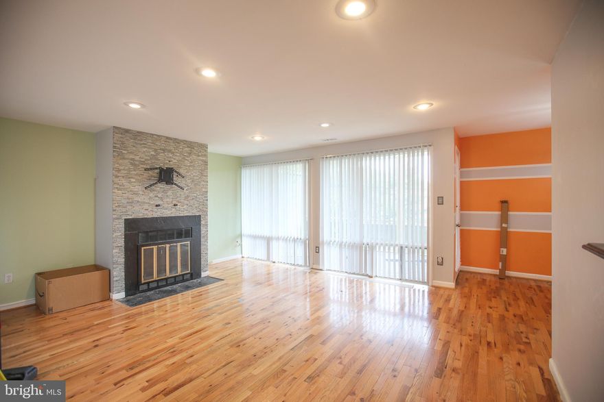 Stylish Condo with Fireplace, New Appliances & Granite Countertops in Holly Hill! This beautifully updated 2-bedroom, 1-bath condo in the sought-after Holly Hill community of District Heights offers a thoughtfully designed layout with modern upgrades throughout. The galley kitchen boasts brand-new stainless steel appliances, granite countertops, and sleek cabinetry —creating a stylish and functional space for cooking and entertaining. The kitchen flows seamlessly into a spacious living and dining area featuring large windows and a cozy wood-burning fireplace as the focal point. Rich hardwood floors add warmth and charm throughout the main living spaces, while both bedrooms provide ample closet space and a sense of privacy. Step through sliding glass doors from the living room to a private, covered balcony overlooking lush green space—ideal for morning coffee or al fresco dining. Conveniently located near the Beltway, Andrews Air Force Base, Metro access, and a wide array of shopping and dining destinations, this move-in-ready home is perfect for first-time buyers or investors seeking a well-maintained property in a prime location.