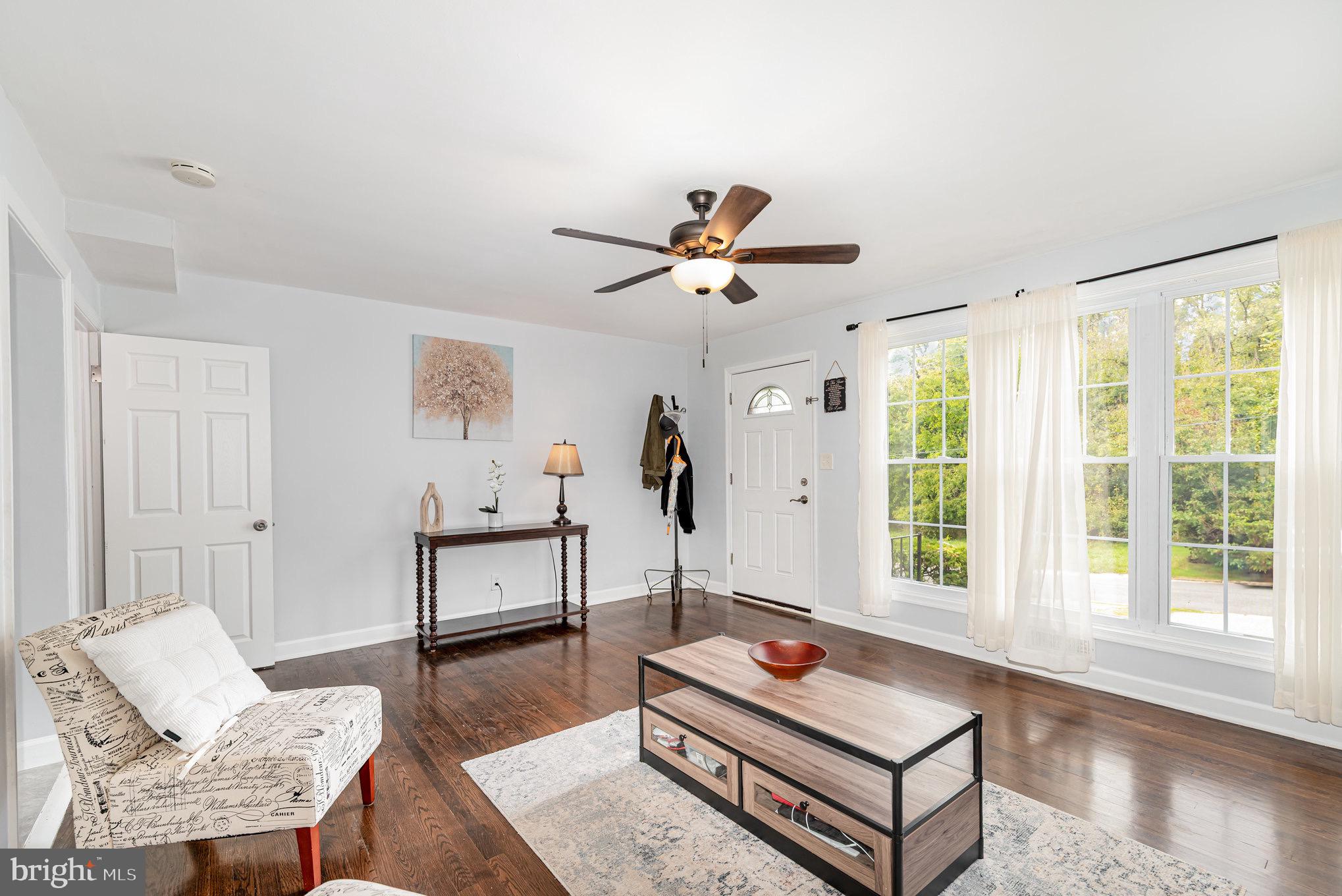 You won't want to miss out on this charming, updated townhome on a tucked away street! The driveway out front provides 2 off street parking spaces so you never have to worry about parking. Inside, the large windows in the front of the house fill the house with natural light. The wood floors are beautifully stained and well maintained.  The eat-in kitchen has granite counter tops, stainless steel appliances (new dishwasher in 2023 and a new microwave on the way), and freshly painted cabinets with new hardware.  The basement is open, fully finished, with a second full bathroom. The house has new doors throughout and upgraded baseboards as well. Conveniently located near The Rotunda, 1-83, Hampden, Cross Keys, the Light rail, and Loyola and Johns Hopkins Universities. Come see it before it is gone!