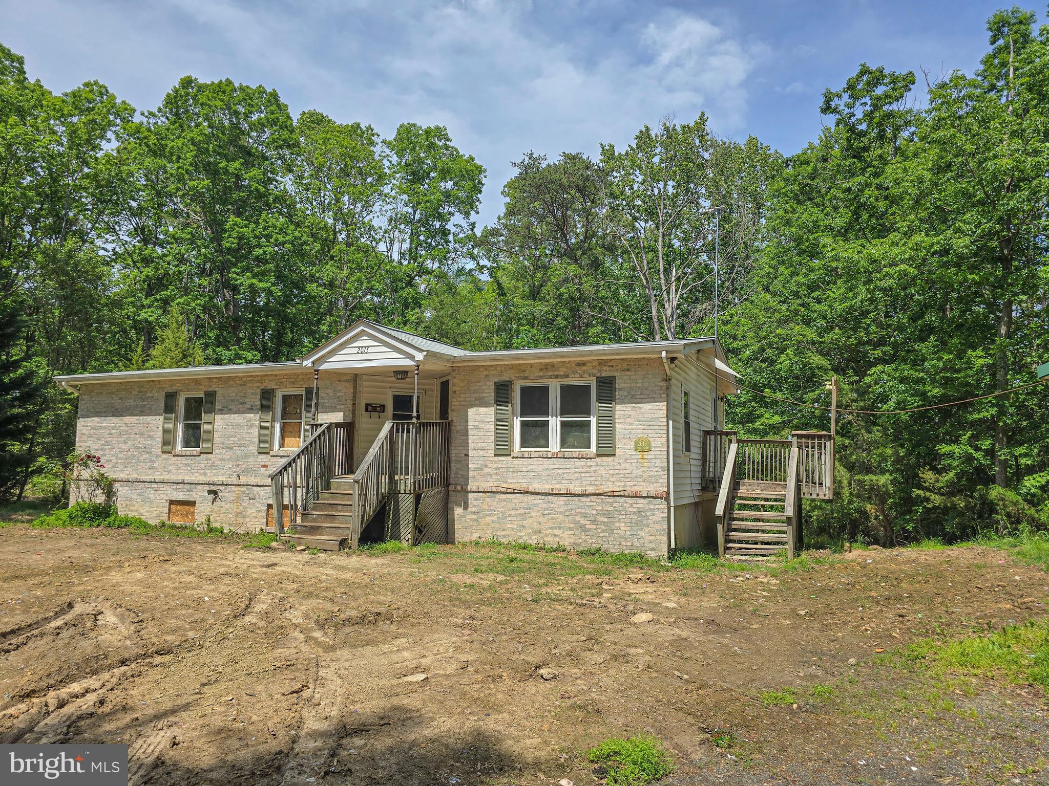 Single family residence now available on a whopping 2+ acres. Located at the end of Elba Ct for maximum privacy, this 3 bedroom 2 full bath home is waiting for a full renovation. Sold 100% AS IS, this property needs everything but has great bones and tons of potential. Unfinished Basement is walkout level and ceilings are over 8' tall. Finishing this will add lots of additional livable space and increase the value. Some roughins are present. Condition of any systems are unknown at this time. Don't miss out on this huge piece of property with potential only limited by your imagination.