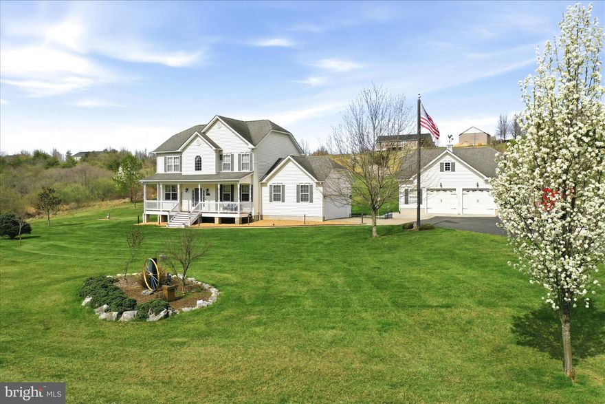 No projects. No compromises. No waiting!

Positioned just off Timber Ridge Road on one of the most desirable exterior lots in Mohr’s Landing, this impeccably maintained Colonial blends refined country living with everyday convenience. With direct state maintained county-road frontage, a paved driveway, and striking curb appeal, the property commands attention from the moment you arrive—and continues to impress at every turn.
The residence offers more than 3,300 square feet of beautifully finished living space and an attached garage with interior access to the kitchen. The home features four bedrooms and three-and-a-half baths arranged in a thoughtful highly functional layout ideal for both daily living and entertaining. Pride of ownership is unmistakable throughout. From the welcoming front porch to the covered rear deck, personal putting green for the golf enthusiasts and outdoor fire pit, every space has been designed for year-round enjoyment.
At the heart of the home, the expansive country kitchen provides abundant workspace and storage while remaining open to the surrounding living areas for effortless flow and connection. Sun-filled main living spaces are anchored by a fireplace and enhanced by generous natural light. On the second level of the home, there is the master bedroom with vaulted ceilings, en-suite master bathroom with walk-in closet, a designated laundry closet with new washer and dryer conveniently located adjacent to the master bedroom, a common area perfect for relaxing and taking in the view, two additional bedrooms and another full bathroom. The fully finished basement—recently refreshed with new paint and flooring—adds outstanding versatility, perfect for a media room, home gym, guest suite, craft room, office or recreation area. The finished basement additionally boasts another large bedroom with walk-in closet, an en-suite full bathroom, a pantry, designated utility closet and an additional oversized closet with custom cabinetry. 
A true highlight is the impressive two-car detached garage, fully heated with a mechanic's crane, new air compressor, workbench with storage cabinets and topped with a newly finished bonus room ideal for a private home studio, or classic retreat that adds an additional 500+ square feet of finished living space . A whole-house propane-fired backup generator further elevates the property, delivering peace of mind and uninterrupted comfort regardless of the season.
Outside, the level, fenced lot is beautifully landscaped and framed by open views, creating a setting that feels both polished and peaceful. Meticulous upkeep is evident throughout—this is a home that has been carefully stewarded and thoughtfully improved over time.
For buyers relocating from Frederick County, Northern Virginia, the Washington, D.C. metro area, or beyond, the location is especially compelling: serene Hampshire County surroundings paired with quick access to Winchester and the I-81 corridor. It offers the rare ability to enjoy space and tranquility without sacrificing connectivity.
Custom-built, immaculately maintained, and truly move-in ready, this Mohr’s Landing Colonial delivers a turnkey lifestyle that is increasingly difficult to find—where quality construction, thoughtful amenities, and an exceptional setting come together in one remarkable offering.