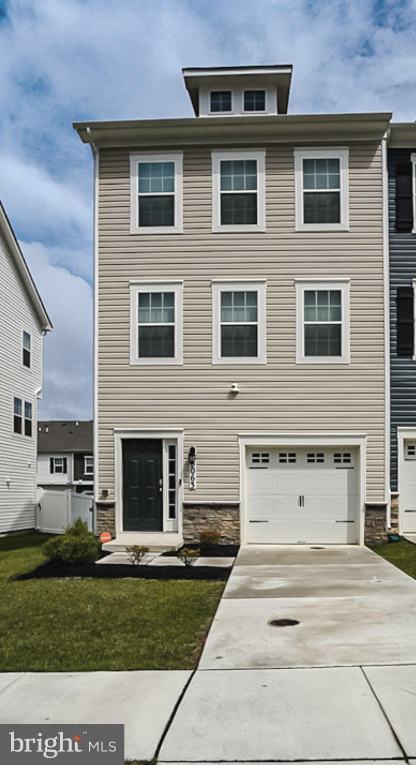 END-UNIT TOWNHOME – Practically BRAND NEW & Loaded with Upgrades!
Welcome to this beautifully maintained end-of-group townhome in like-new condition, ideally located just minutes from shopping, dining, and major commuter routes!
Enjoy cooking and entertaining in the gourmet kitchen featuring quartz countertops, a large center island, 42” cabinetry, stainless steel appliances, gas stove, and a pantry. The spacious dining area opens to a vinyl deck with sleek railings through large sliding glass doors, perfect for indoor-outdoor living.
The main level boasts an expansive family room with high ceilings and luxury vinyl flooring throughout, as well as a convenient powder room for guests.
Upstairs, the grand primary suite features a walk-in closet, ceiling fan, and a private en-suite bath with double vanities and a walk-in shower. Two additional sun-filled bedrooms and a stylish hall bath with a quartz vanity and deep ceramic tub offer comfort for the whole family. You'll also love the convenient upper-level laundry!
The finished lower level includes a cozy family room (or potential 4th bedroom), a full bath, sliding door to a second deck, storage closet, and one-car garage access.
Outside, the new vinyl privacy fence encloses the backyard—ideal for pets, play, or outdoor entertaining. As an end unit, enjoy the bonus of extra side windows that flood the home with natural light.
This home has it all—modern style, thoughtful layout, and unbeatable location. Don’t miss your chance to own this exceptional property in a vibrant, amenity-filled neighborhood. Schedule your tour today!
