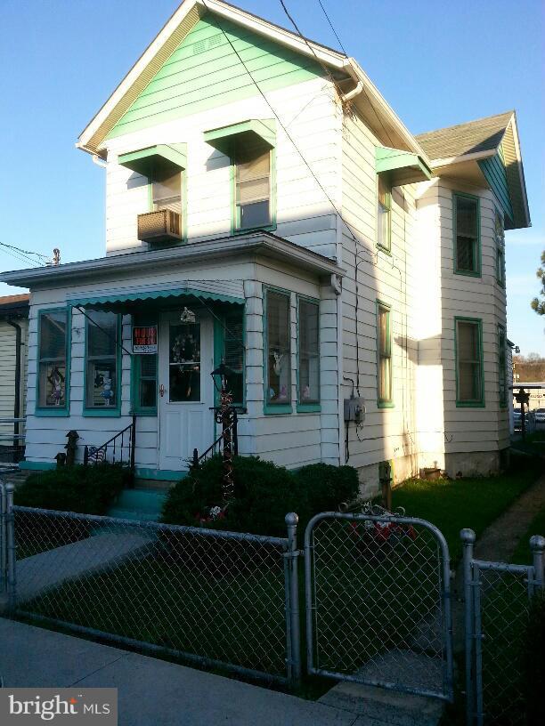 Motivated seller... adorable and affordable. Living room and separate dining room have hardwood floors, eat in kitchen, plenty of storage with full basement, 1 car garage with walk-up work shop, fully fenced yard, front and rear enclosed porches.
