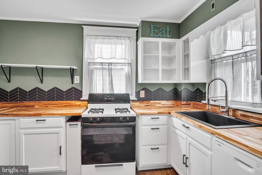 Back on the market! Buyers default  - no fault of the seller. 
Step inside and marvel at the gorgeous natural woodwork that’ll have you feeling fancy without even trying. And yes, there's a split staircase—because why take one route when you can take two? If dramatic entrances (or exits) are your thing, this house has you covered. 
Speaking of covered, wait till you see the front porch—perfect for sipping coffee, tea, or whatever gets you through the day while watching your neighbors wish they lived here too. And for those chilly evenings, gas heat will keep you warmer than the heart of your high school crush. 

Ready to host some dinner parties? The formal dining room is ideal for impressing friends or pretending you're part of a fancy period drama. And let’s not forget the **detached** one-car garage—it’s like a personal fortress for your car, lawnmower, or that half-finished project you’re totally getting around to someday. 

The full unfinished basement and walk-up attic provide limitless opportunities—whether it’s a secret lair, storage for your questionable shopping habits, or just a really big empty space that screams "potential." Closet space abounds too, meaning you can hide all your clutter and pretend you're a minimalist. 

The bathroom features a bathtub/shower combo with a molded fiberglass surround, which sounds very fancy, but really just means it's nearly impossible to mess up. Perfect for bath time battles with kids or unwinding after a long day of pretending to be an adult. 

All appliances are included, making this house truly turnkey. Just bring your toothbrush and your best Pinterest boards, and you're good to go! 

So if you're in the market for a home that's comfortable, affordable, and has enough charm to make you forget about your long list of adult responsibilities—this is the one.