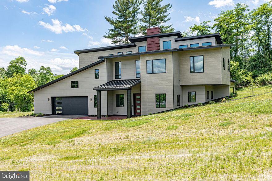 This custom, luxury, eco-friendly home named “38 Corners” is a truly unique structure  now available in the community of Agrestic.  Conveniently located on Rt 27, 90 minutes from DC and less than an hour from Baltimore.  This modern, luxury, smart home has been meticulously crafted to give you a net zero luxury lifestyle.  Featuring a Tesla Powerwall, Solar panels, Concrete ICF and Geothermal heating and cooling system mean your energy bill will never be lower.  Peak summer and winter utiility bills are expected to stay under $30/month! Best of all it comes pre-wired with speedy fiber internet. 

Enter your home through a 4 x 8 foot solid wood door and into your kitchen featuring Shiloh Cabinets with slow close technology and a Z Line 48 Inch, 8 Burner Gas range.  Wow your friends with the Hidden DishWasher, a counter depth Dacor smart fridge/freezer and Granite Countertops.

Entertain friends and family in your living room with a stunning solid concrete chimney rising through the center of the 40 foot ceilings, leading the eye to the modern exposed, spiral ductwork and steel handrails. All while your Smart Windows by Pella keep your house cozy.

Find the main suite on the first floor with a walk-in closet, ADA compliant bathroom, curbless shower and bluetooth speaker system.

Follow the LED lit, solid maple floating stairs to the second floor and find the second owner suite and the remaining 3 bedrooms. You will also find your spacious laundry room overlooking the rolling hills of Agrestic. 

Efficiency was top of mind throughout the design: The geothermal loop harnesses the energy of the earth to keep the air comfortable and works in sync with the water heating systems to lower your impact on the environment. 

Outside you will find a super durable, 50 Year Standing Seam Metal Roof. Insulated Garage Doors lead to a beautiful 2 car garage with stamped epoxy floors and side mounted smart garage door openers. The overhangs around the house have been adjusted for summer sun to keep your living space comfortable. The skylights are remote driven and close automatically if they sense rain. Smart Pella Windows and doors link to an app on your phone showing you what is open and when, eliminating any need for a security system. 

This house is waiting for you to make it a home get ready to come home to Agrestic.