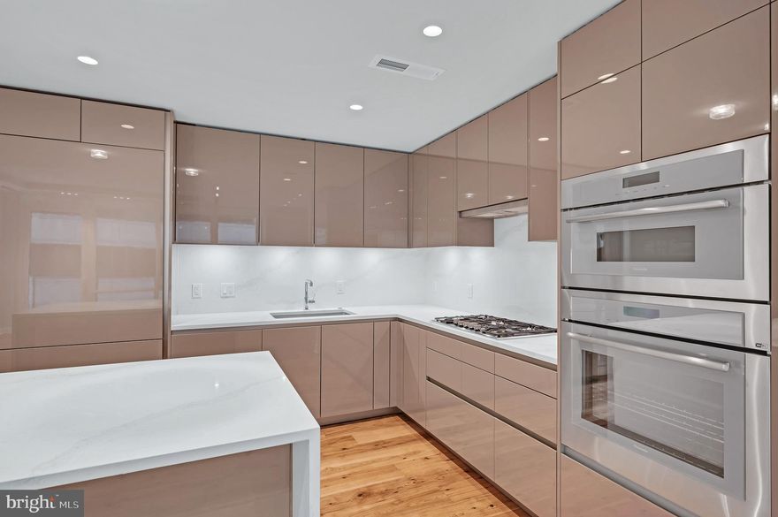 Rare opportunity in practically new (built 2021!) luxury condo in the heart of Rosslyn – sophisticated urban living at its finest. This corner unit residence offers a spacious living and dining area ideal for entertaining.  Features include 7-inch hand scraped hickory flooring, floor-to-ceiling windows, and an oversized balcony. Top-of-the-line chef’s kitchen with Thermador appliances, a wine fridge, Snaidero cabinets, and Quartz countertops and a waterfall island. Stunning baths feature heated flooring, Bardiglio marble, Brizo faucets and spa-inspired glass showers. A separate laundry room is fitted with cabinets, a laundry sink and a front-loading washer and dryer. Building amenities include white-glove front desk concierge services 24/7, double level fitness center, and outdoor swimming pool. You’ll love the huge two-level rooftop club room with grills, outdoor dining spaces, and stunning views. Conveniently located just blocks to the Rosslyn and Courthouse Metro Stations on the Blue, Orange and Silver lines with a walk score of 94. Just across the bridge from Georgetown for additional shopping and dining options. Convenient to downtown Washington DC and Reagan National Airport. Two assigned parking spaces convey as well as a large storage unit. Also offered furnished for additional $1500/mo.  6 month minimum lease term.