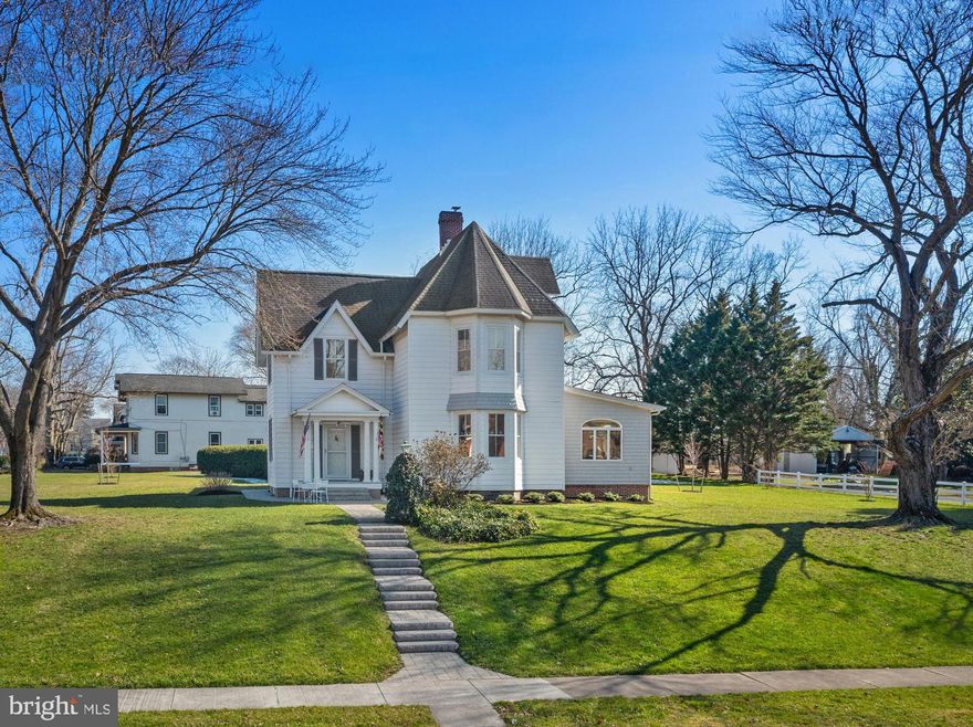 Price Improvement...Owners Ready To Sell! This renovated circa 1860 Victorian home has a clean, COASTAL vibe and is located in downtown Historic Centreville on Maryland's beautiful and relaxing Eastern Shore! The Town's square features one of the oldest courthouses in the State (from 1796) which is a short distance to the Town's waterfront wharf. In this EXCEPTIONAL home, the past has been merged with modern, coastal touches! A favorite home by many who visit, with it's generous-sized living spaces, is situated on nearly an acre which is rare in the Town. If you like Holiday parades, this property is on the Town's Holiday parade route and the current owners have hosted large lawn parties to watch the festivities! Short walks from the home will take you to restaurants, the town's library and Town Square, the wharf, walking trails, and parks! Since purchasing the home in 2020, the owners have made a large investment to transform it! The kitchen and two full baths have been gutted and redone and a powder room was added. So much more was done which includes paint, lighting, new attic insulation, equipment for 2 (of 3) HVAC zones replaced, buried electrical line from the street, additional electric panel, foundation bricks pointed up, added woodburning fireplace insert and pointed up brick chimney, exterior painted the shutters/side room/front-side porch decking, 4 new storm doors, new family room slider, rear entry completely redone with new door and siding, new floors in all bathrooms,  kitchen and 3rd floor, ceilings redone in 2nd floor office and 3rd floor bedroom, upper gutters replaced, and much more! The kitchen's "WOW Factor" includes a custom built-in booth made from recycled horse fences, quartz countertops, shiplap, GE Cafe 6 burner gas stove and more.  Another favorite room is the living room with high ceilings, brick mantle with fireplace and original plaster ceiling moulding trim. The large, spacious dining room can easily accommodate a table for 10 + and impressive foyer and living room featuring gorgeous hardwood floors with parquet borders displaying the craftmanship of yesteryear. 10' ceilings in the LR/FR/DR and Foyer as well. A captivating feature of the home is the foyer staircase with original wood railings leading to the 2nd floor where you'll find period pine floors.  Rounding out the first floor is a large family room overlooking Commerce Street and the front/side and back yards. The 2nd floor features 4 rooms all with hardwood floors (3 used as bedrooms and 1 an office but could easily be 4 bedrooms) and a full bath and ample closet space. For a little fun venture up to the 3rd floor for the 4th bedroom with new flooring/ceiling, a large walk-in cedar closet and access to the attic. Outside an almost month-long project in 2021 of new steps/pavers leading from the front sidewalk to front door around to the side porch and also a back door path/steps/landing. Also added were flower beds with many perennials on the front/side and back of home and a new shed in 2021 (there are 2 sheds total with part of one having a workshop). The owners have taken great pride and have seeded and taken care of the lawn which garners many compliments! In Fall 2023  five new trees were planted. This is a home that is a combination of the new features mixed with the old warmth and is both cozy and impressive all wrapped in one. Please note that a June 2020 appraisal has home's total square footage to be 306 gross square feet more than what is recorded in tax record. Metro-areas like Annapolis, Baltimore or DC are commutable as well all the Chesapeake Bay area has to offer with boating, dining, hunting or just relaxing. Make your appointment today for this "ONE-OF-A-KIND" 1860s home!  Spring 2023 the Sellers had Architectural drawings for a first floor in-law suite.  Note: the listing agent is also one of the owners.