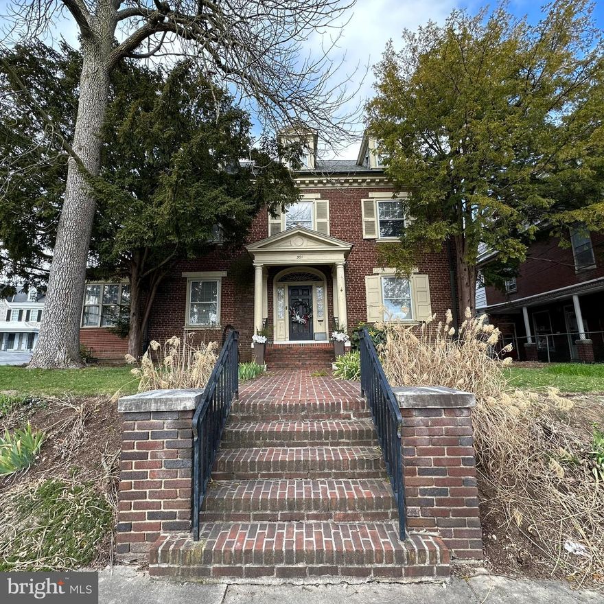 Experience this classic brick colonial, blending timeless charm with contemporary comforts. This remarkable residence offers four bedrooms with 2 and a half baths throughout, a living room adorned with a fireplace, a sunroom measuring 28x11, a formal dining room, a spacious kitchen and much more. Enjoy the elegance of crown moldings and beautiful hardwood floors throughout.  Ample storage ensures organizational ease, while a bedroom with a private balcony adds a touch of luxury. With a graceful staircase and a private stairway from the kitchen, this home exudes both grandeur and practicality. Numerous recent enhancements include the installation of dual-zone HVAC in 2020, a complete renovation of the hall bathroom in 2022, and the incorporation of a gas furnace in the sunroom along with gas logs for the fireplace in the formal living room in 2019! Please take a moment to view the video walkthrough!