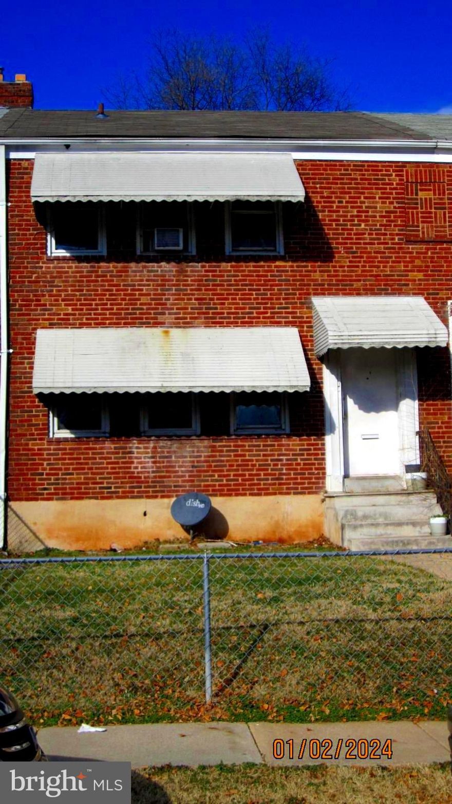 Brick interior row house featuring 2 apartments.  Each apartment has a kitchen, living room, 2 bedrooms, 1 bathroom, a stove and a refrigerator.  Basement is unfinished.  Roof replaced in 2017.  The property has individual  meters, hot water tanks and  furnaces.  Asking price reflects need for renovation/upgrading.  Buyer can live in 1 apartment and rent out second unit.  Seller will make no repairs.  Property being sold AS-IS.  Buyer to verify zoning.  Seller used property as a rental for 11 years.