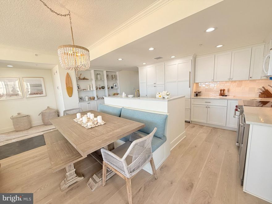 Welcome to your dream coastal escape! This beautifully updated 4-bedroom, 3-bathroom condo offers over 2,000 square feet of refined living space, just five feet from the beach. Whether you're watching the sunrise over the ocean or the sunset across the bay, this home brings you front-row seats to it all.

Step inside to find a bright, open layout with recent upgrades throughout—including new flooring, modern finishes, and custom touches that elevate every room. The spacious kitchen flows effortlessly into the living and dining areas, allowing you to cook dinner while watching the kids play safely in a private, fenced-in sand area just outside your door.

Relax on your private balcony or head up to the exclusive rooftop pool, where panoramic views of the Atlantic and the Bay surround you in coastal serenity. And with newly installed storm shutters, you’ll have peace of mind no matter the weather.

Perfect as a vacation home or full-time residence, this turnkey property combines the best of convenience, style, and beachside living—all just steps from the surf. Seller excludes personal photos & personal belongings.