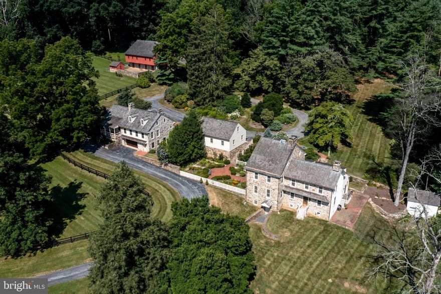 Situated in the Heart of the French Creek Valley, this fully renovated turnkey Gentlemen's Farm is a rare opportunity to buy history and privacy in a community that is quickly developing. This heirloom quality property beckons you to the 62 acre estate featuring a classic Chester County Fieldstone Main house, Guest house, 2 car garage, a special Historic Bank Barn with 5 stalls for horses, a large stocked Pond(approx an acre) and so much more!  The original portion dates to the late 1700's plus an addition  historically accurate in the Federal-style with the appropriate millwork and classic hardware.  Great attention was paid to light and layout throughout the home, all the renovations done over the years with attention to detail and the highest quality craftsmanship.  Most recently the Gourmet kitchen was completely redone to fulfill any professional chef's design including a Wolf 6-burner gas stove with griddle and double oven, complimented with a Viking vent fan, Sub Zero refrigerator, farmhouse sink and huge center island with custom wood countertop.  The breakfast area enjoys the vistas through the new sliders, out to the new deck(4' x 8'), dual stairs down to antique brick patio(11' x 45')with a view of the awesome spring-fed pond. Just off the Kitchen leads to the mudroom and out to the covered brick rear porch(8' x 22').  From Kitchen is the large Family room with wood burning fireplace.  The Living room and Dining room both have 9' ceilings and wood burning fireplaces.  The completely renovated Master Suite has everything, including fireplace, stylish bathroom, walk-in closet totally customized and convenient laundry room.  The guest house was built  and renovated in the same style with the classic fieldstone and has a covered brick front porch(6' x 18'). The open floor plan boasts a great room with fireplace and kitchen encompassing great design space(23' x 25') with french door to covered deck(8' x 18').  There's also the Living room(13' x 17'), 1st floor bedroom(12' x 14'), Hall bathroom, 2nd floor bedroom(14' x 15') and a full bathroom.  The lower level has a laundry room and a 2 car garage.  Between the Main and Guest house is the oversized 2 car garage with loft storage above.  The spring house below feeds fresh water to the pond and above is a nice potting shed. There's copper gutters and downspouts along with cedar shake roofing.  This estate is a rare opportunity to own a very special property in the French Creek Valley!
