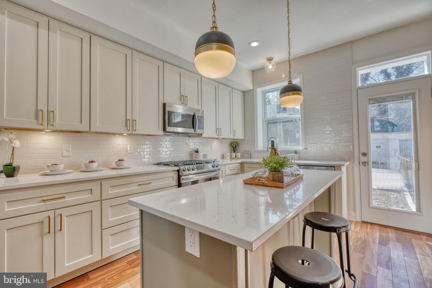 Compete renovation with historic details in Reservoir Hill.   Very tastefully done custom home design.  Primary suite with double vanity and standing shower.  Washer and dryer conveniently located on second floor.  Private entrance for the basement bedroom.  Solid core doors.   Exotic Angico 3/4 inch hardwood flooring throughout.  New roofing including the historic terracotta cornice.  Convenient location to transportation, including Penn Station, and amenities.  Home builders warranty included with purchase.